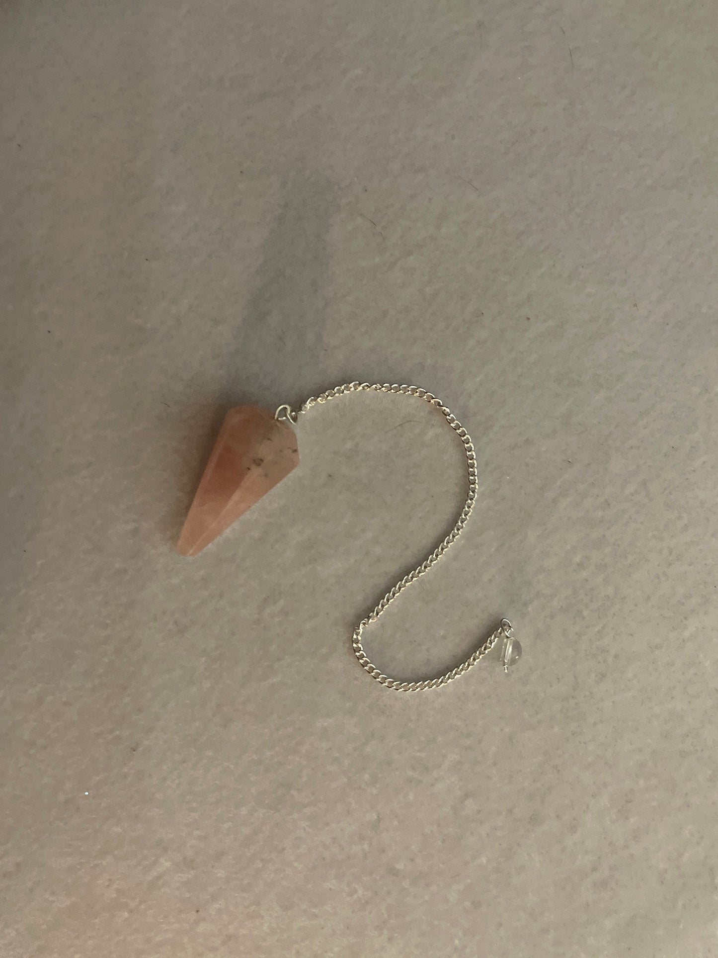 This beautiful Rose Quartz Pendulum is 1.5” and with chain is 8”