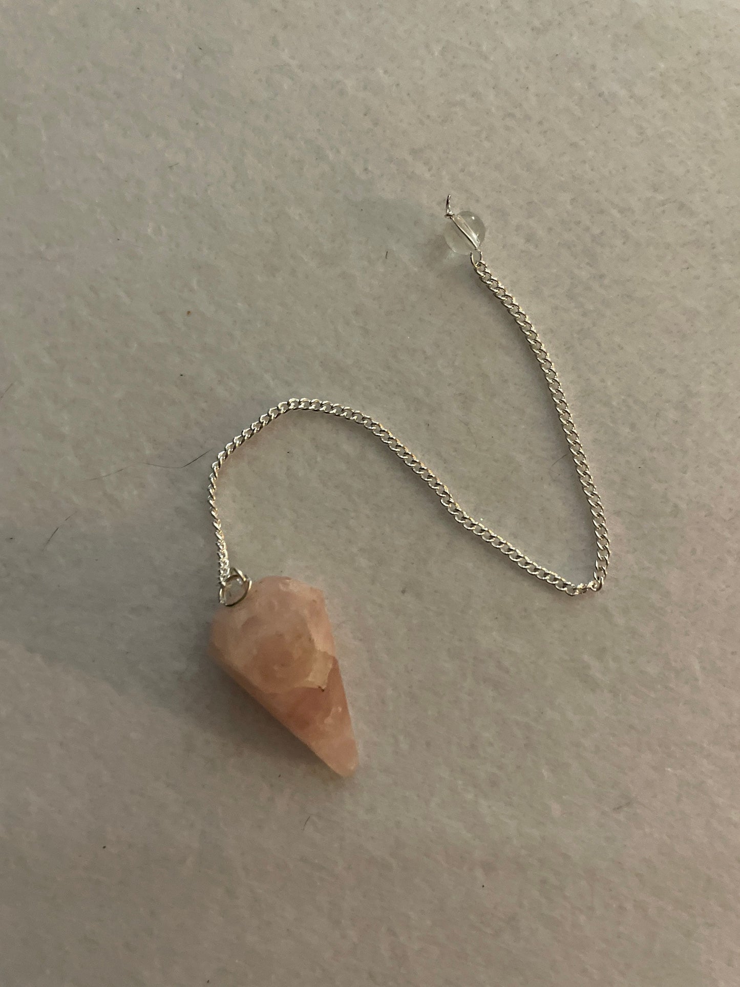 This beautiful Rose Quartz Pendulum is 1.35” and with chain is 8”