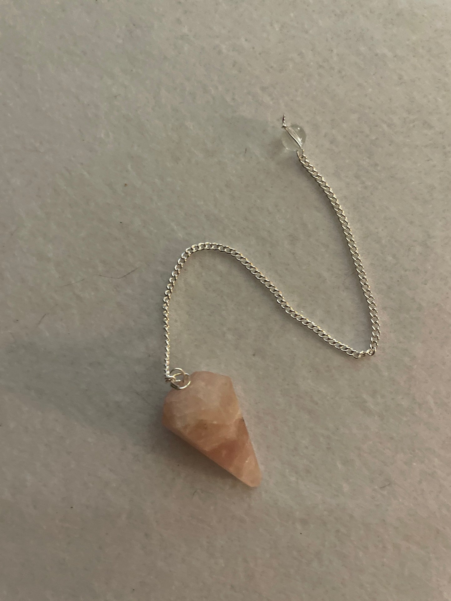 This beautiful Rose Quartz Pendulum is 1.35” and with chain is 8”