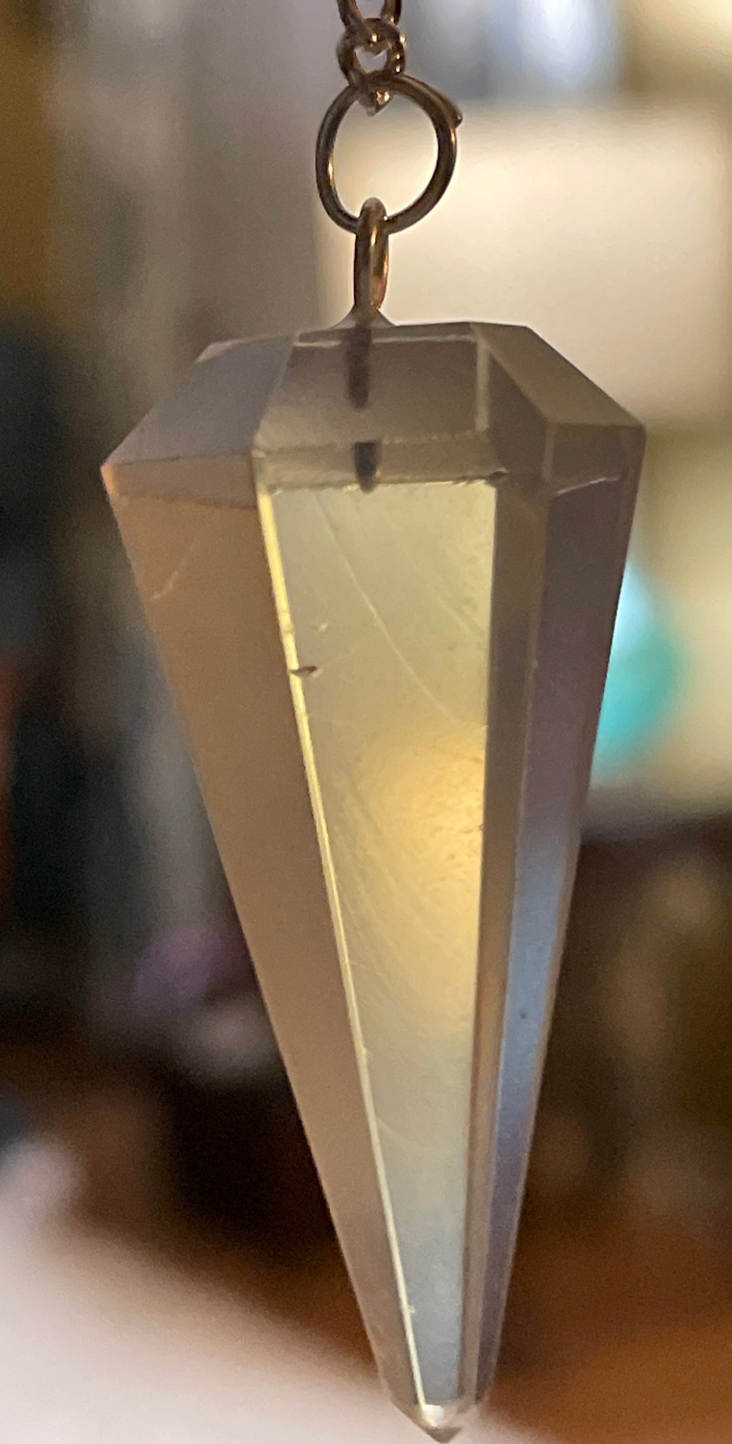 This beautiful  Opalite pendulum is approximately 1.5” and with chain is 8.25”