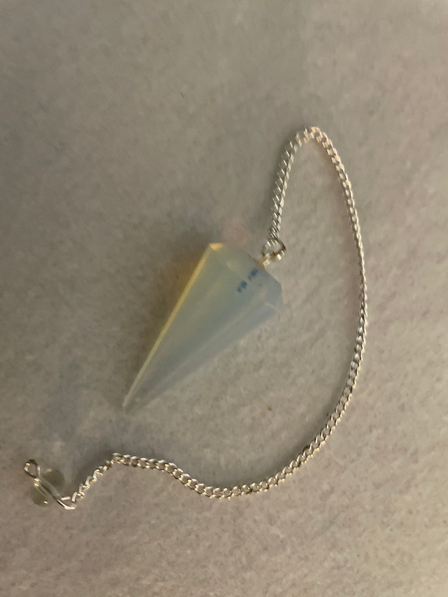This beautiful  Opalite pendulum is approximately 1.65” And with chain is 8.5”