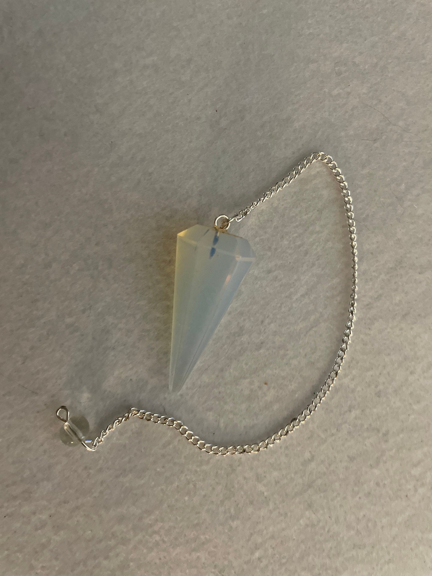 This beautiful  Opalite pendulum is approximately 1.65” And with chain is 8.5”