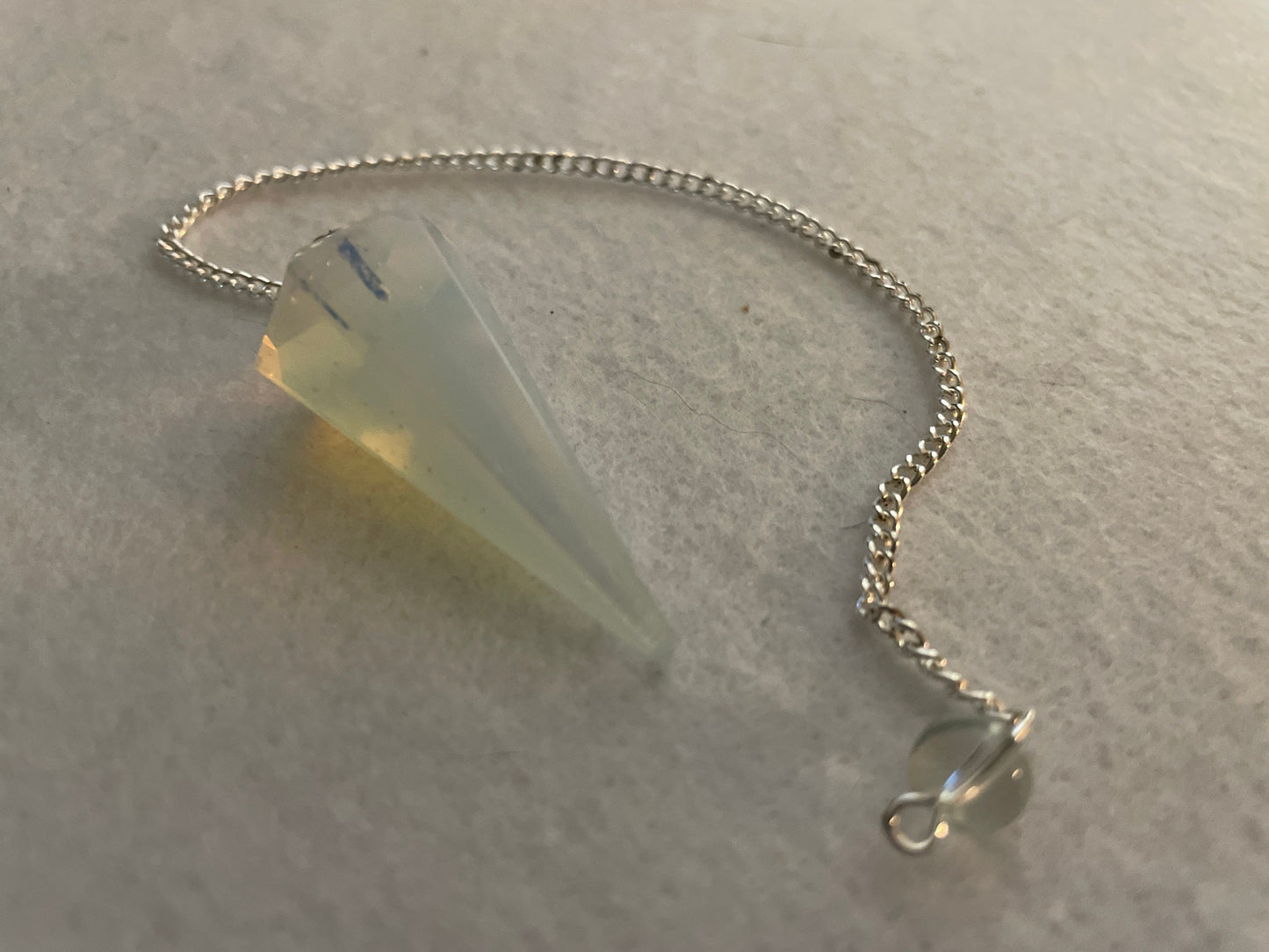 This beautiful  Opalite pendulum is approximately 1.65” And with chain is 8.5”