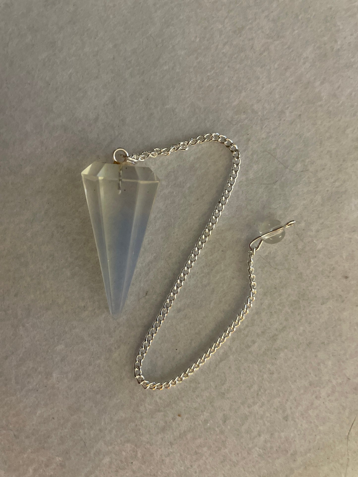 This beautiful  Opalite pendulum is approximately 1.65” and with chain is 8.5”