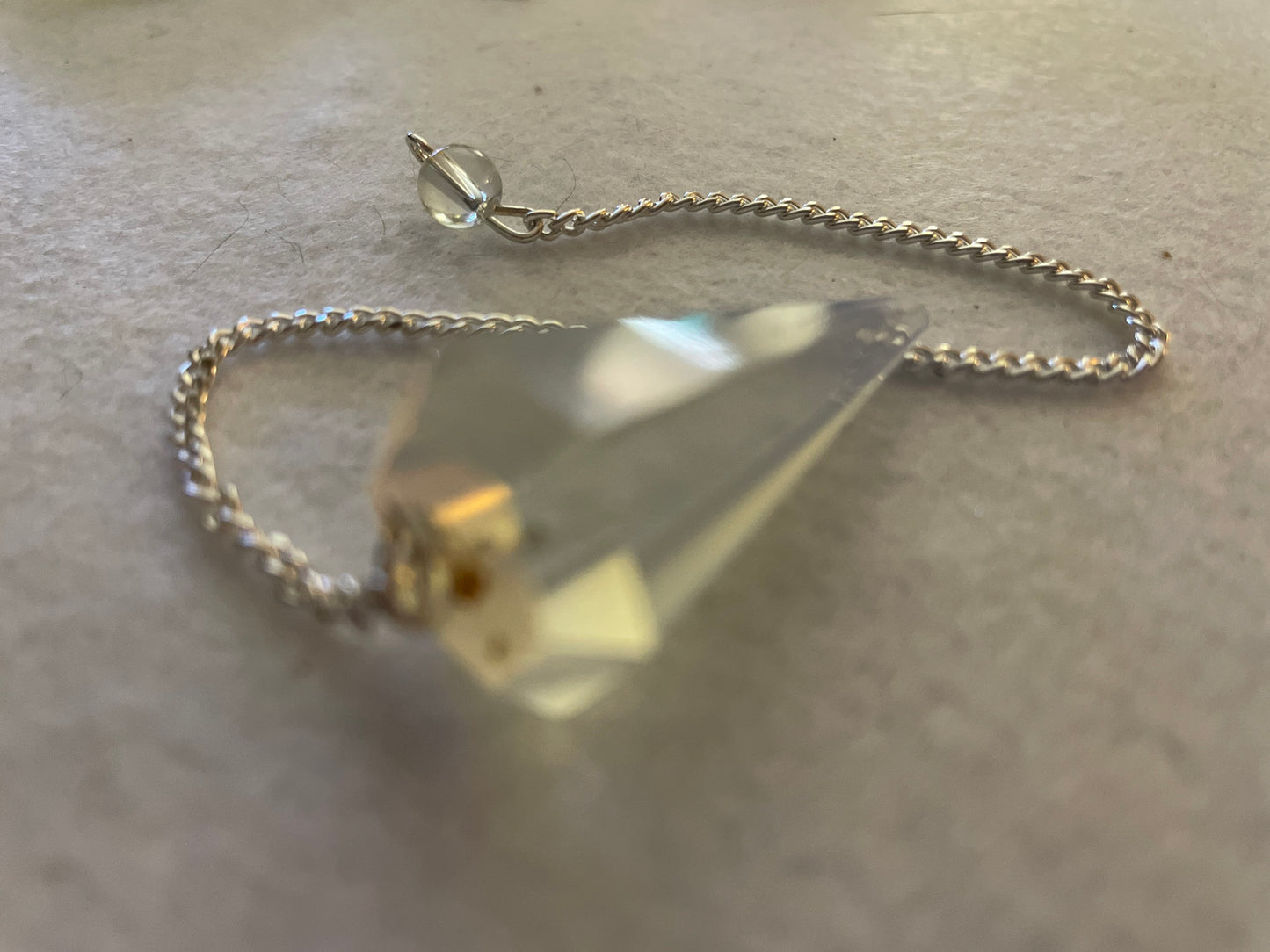 This beautiful  Opalite pendulum is approximately 1.65” and with chain is 8.5”