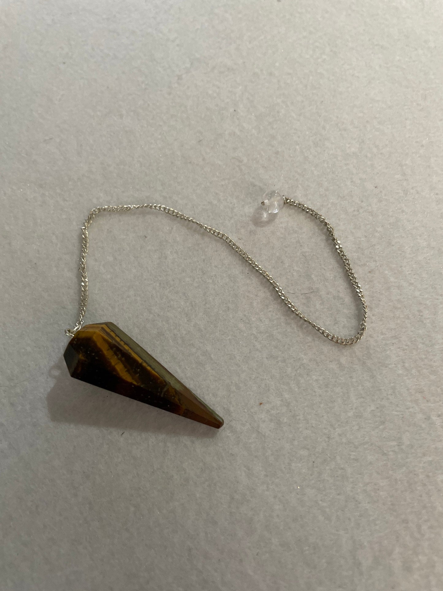 Beautiful Tiger’s Eye pendulum ornaments perfect for dowsing. Hang it in a well lit window, from the ceiling or on the wall!