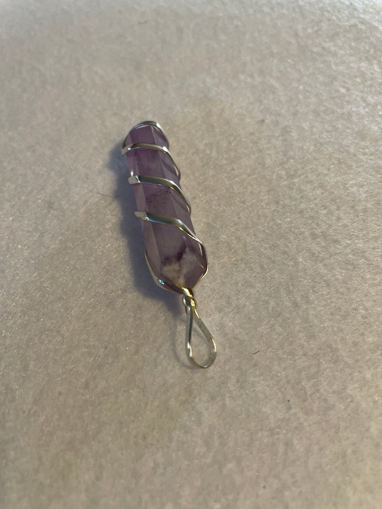 Gorgeous Amethyst Point Pendant is 1.5” and is wrapped in precious silver