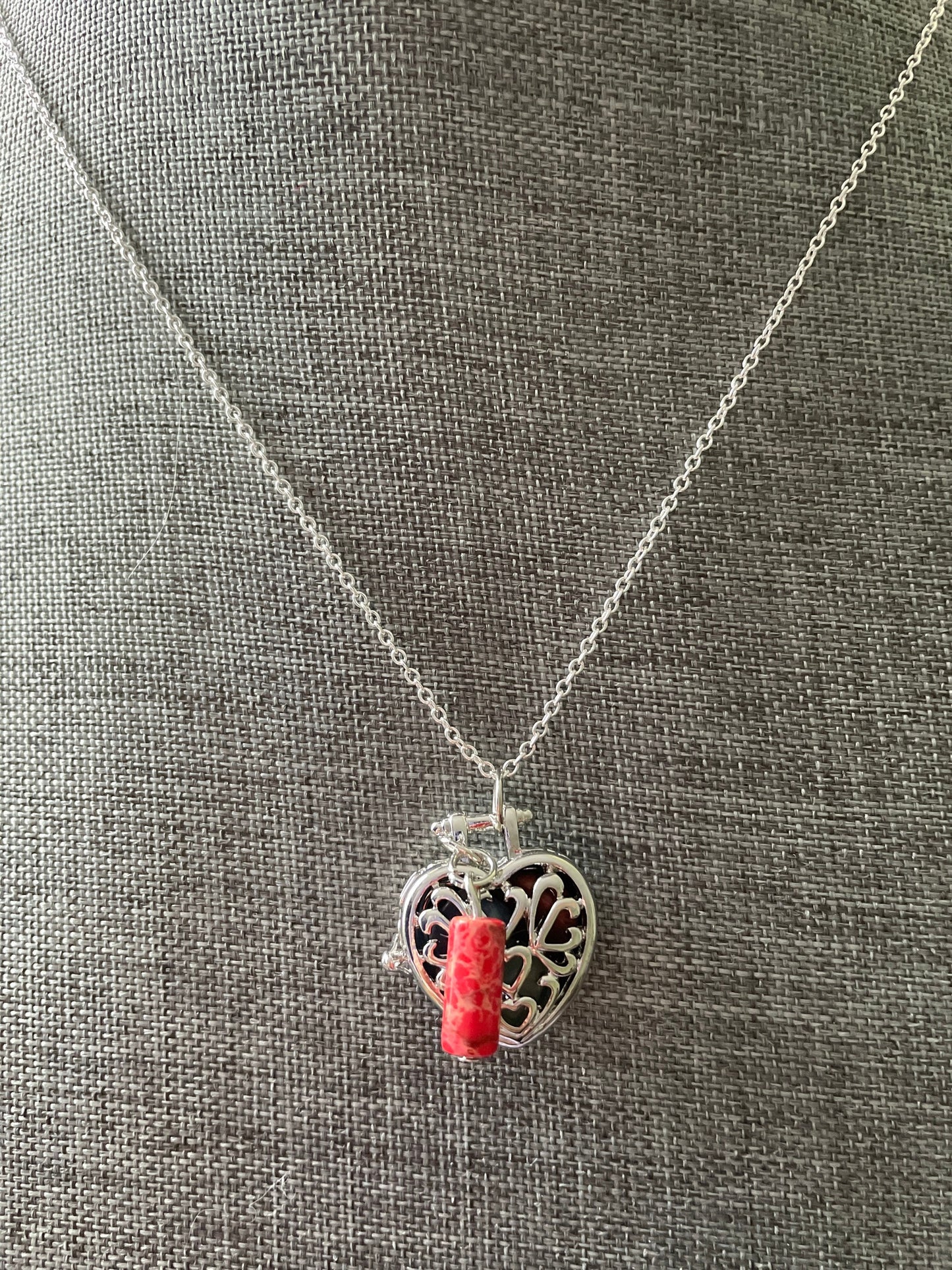 Silver stainless steel locket filled with crystals on 16+” silver stainless steel chain