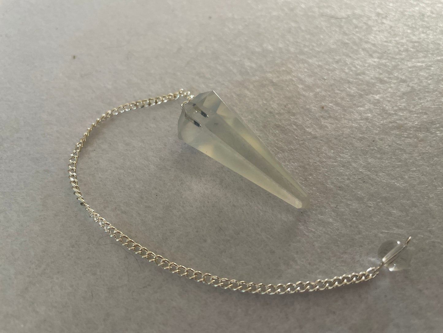 Opalite pendulum is approximately 1.65” and with chain is 8.5” total length