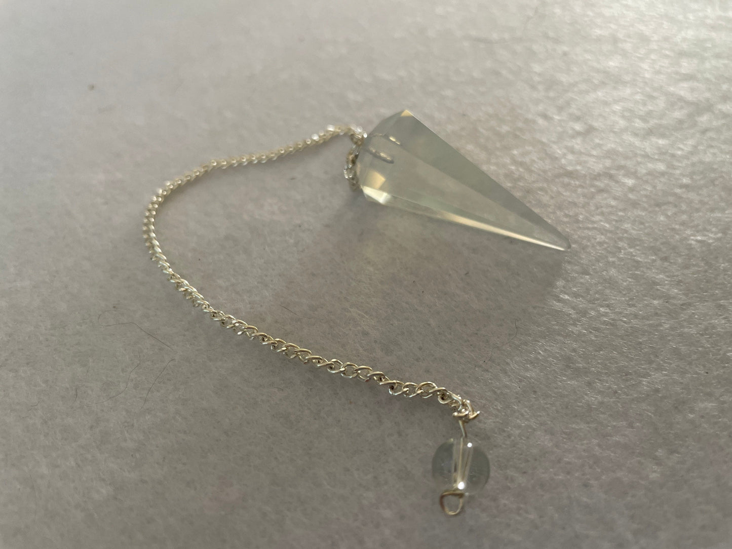 Pretty Opalite pendulum is approximately 1.5” and with chain is 8” total length
