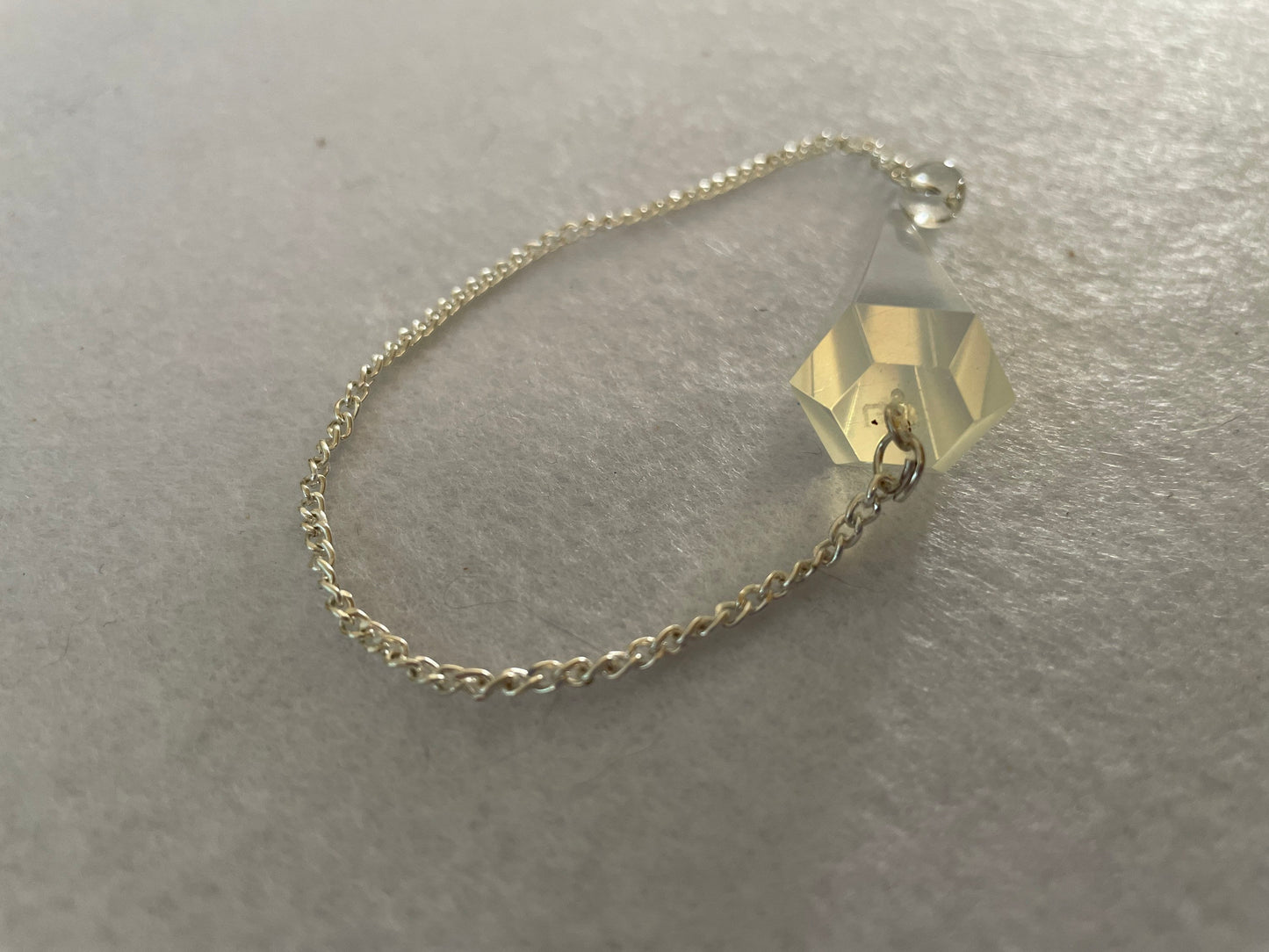 Pretty Opalite pendulum is approximately 1.5” and with chain is 8” total length