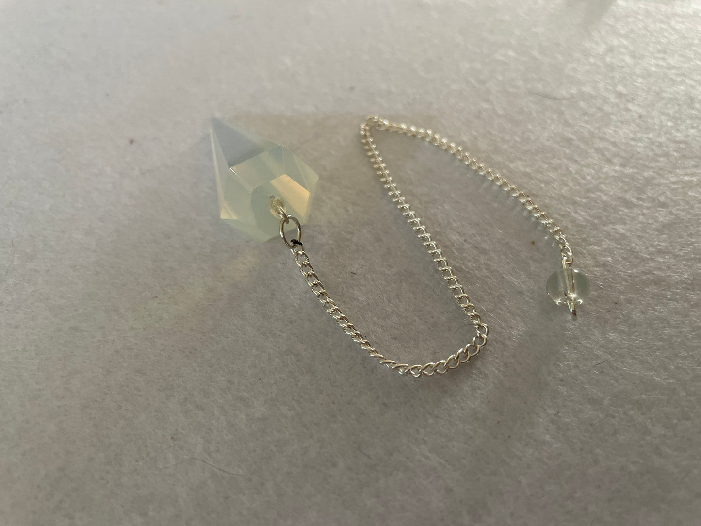 Gorgeous Opalite pendulum is approximately 1.65” and with chain is 8.5” total length