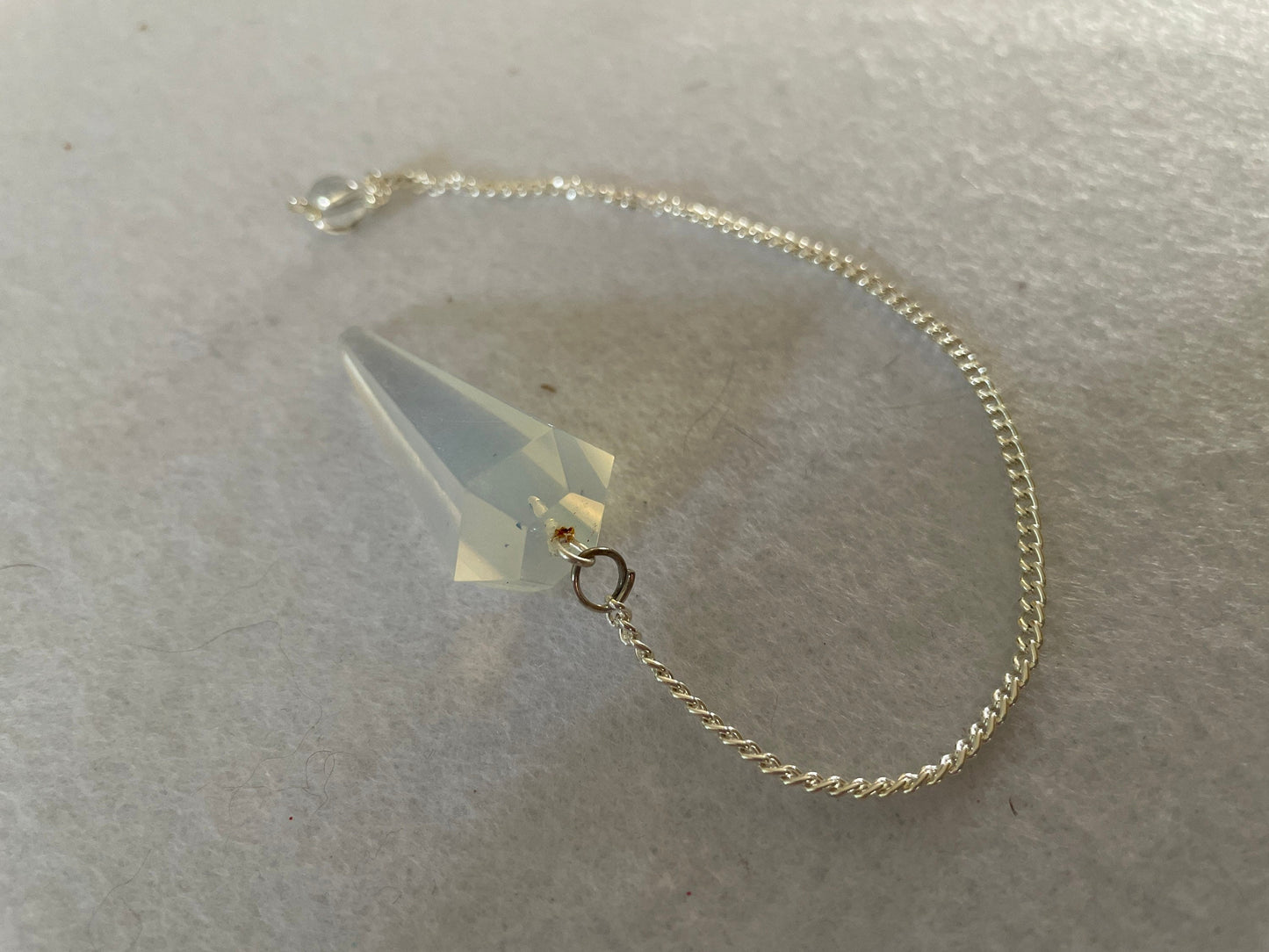 Nice Opalite pendulum is approximately 1.5” and with chain is 8.25” total length