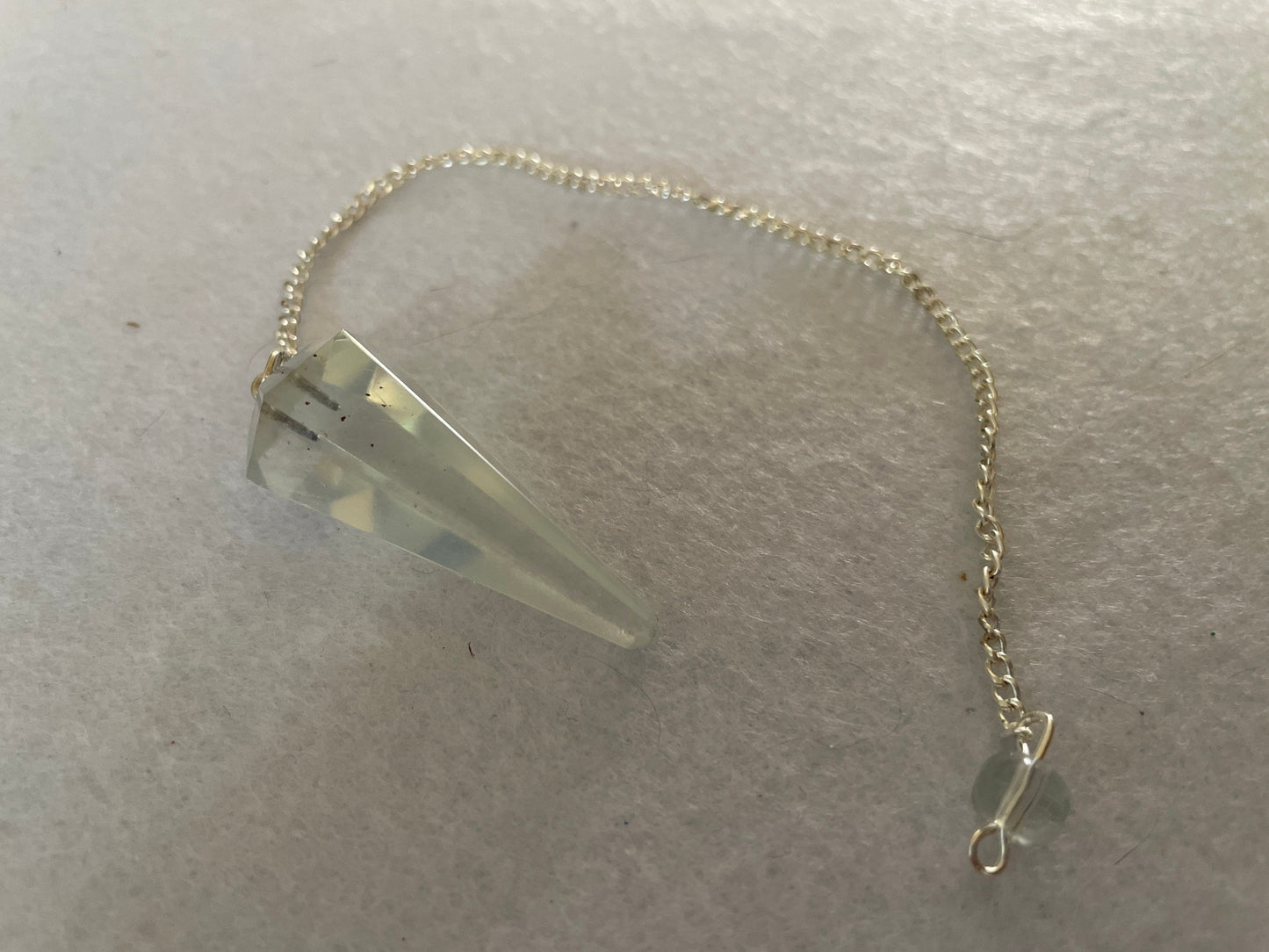 Beautiful Opalite pendulum is approximately 1.5” and with chain is 8.25” total length.
