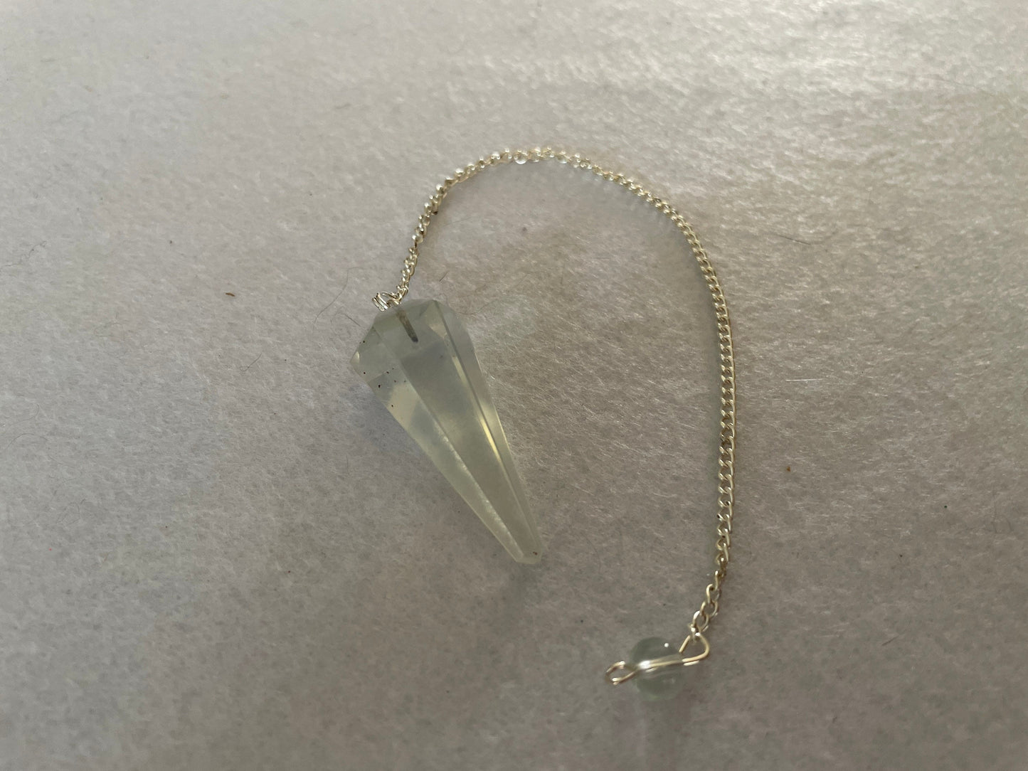 Beautiful Opalite pendulum is approximately 1.5” and with chain is 8.25” total length.