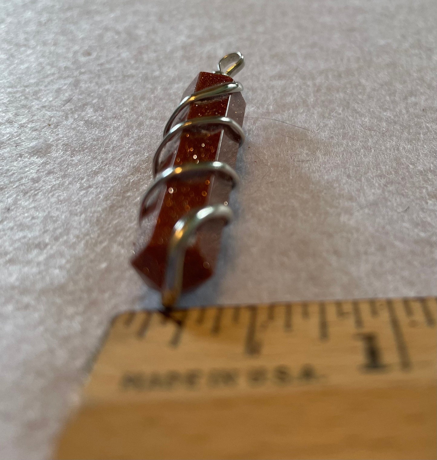 Gorgeous Goldstone Point Pendant is 1.5”