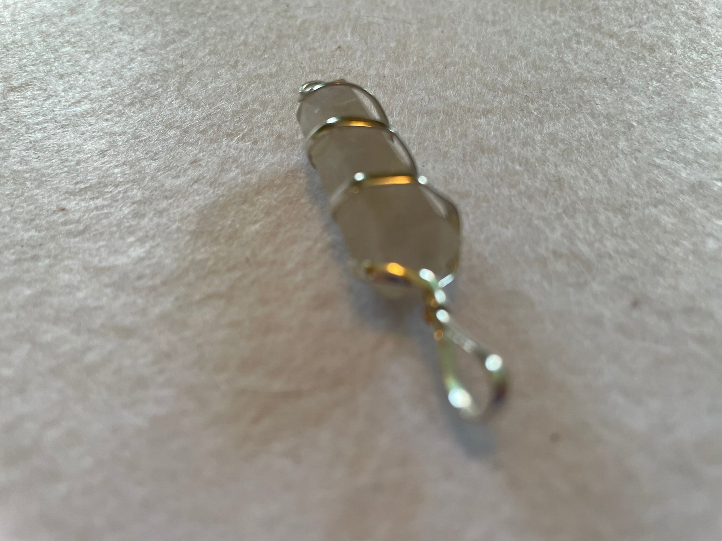 Beautiful Clear Quartz Point Pendant is  1.50” and is attached to precious silver making the total length 2”