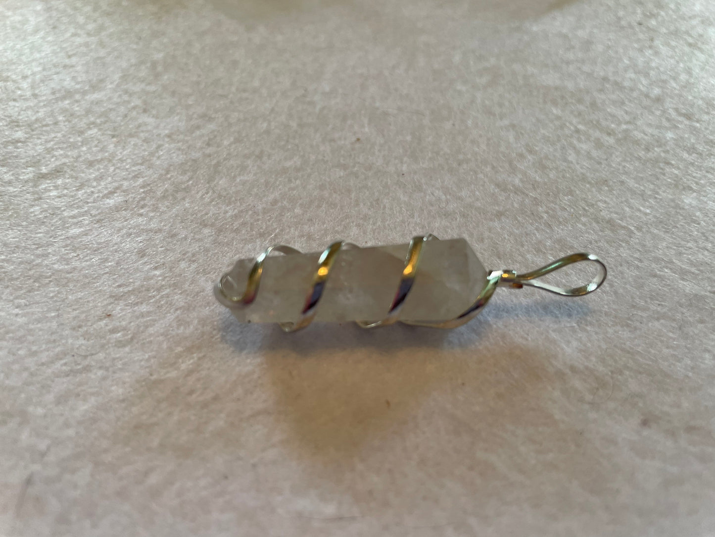 Beautiful Clear Quartz Point Pendant is  1.50” and is attached to precious silver making the total length 2”