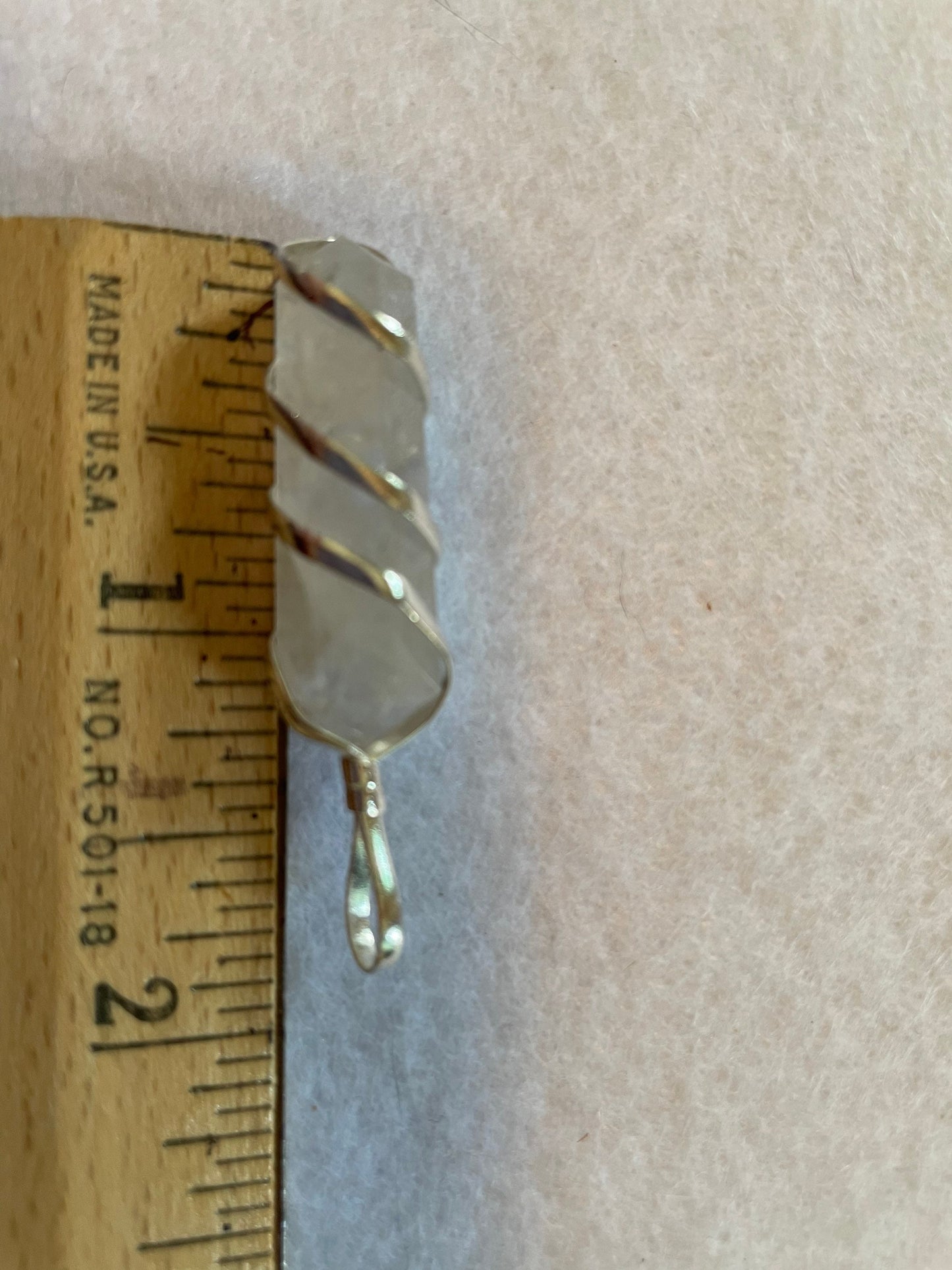 Beautiful Clear Quartz Point Pendant is  1.50” and is attached to precious silver making the total length 2”