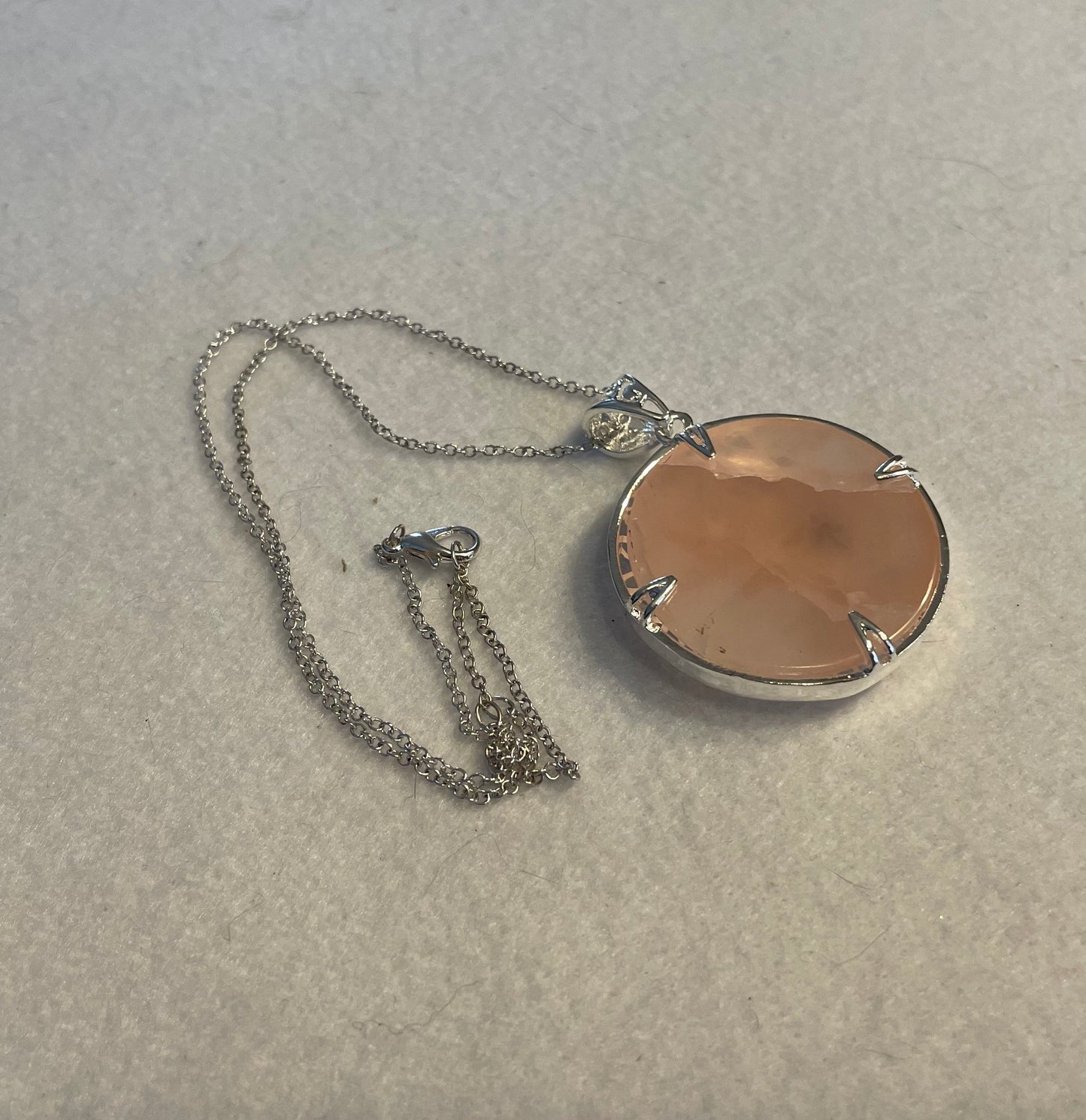 Silver round Flower of Life Rose Quartz crystal necklace on 16+ inch silver plated chain