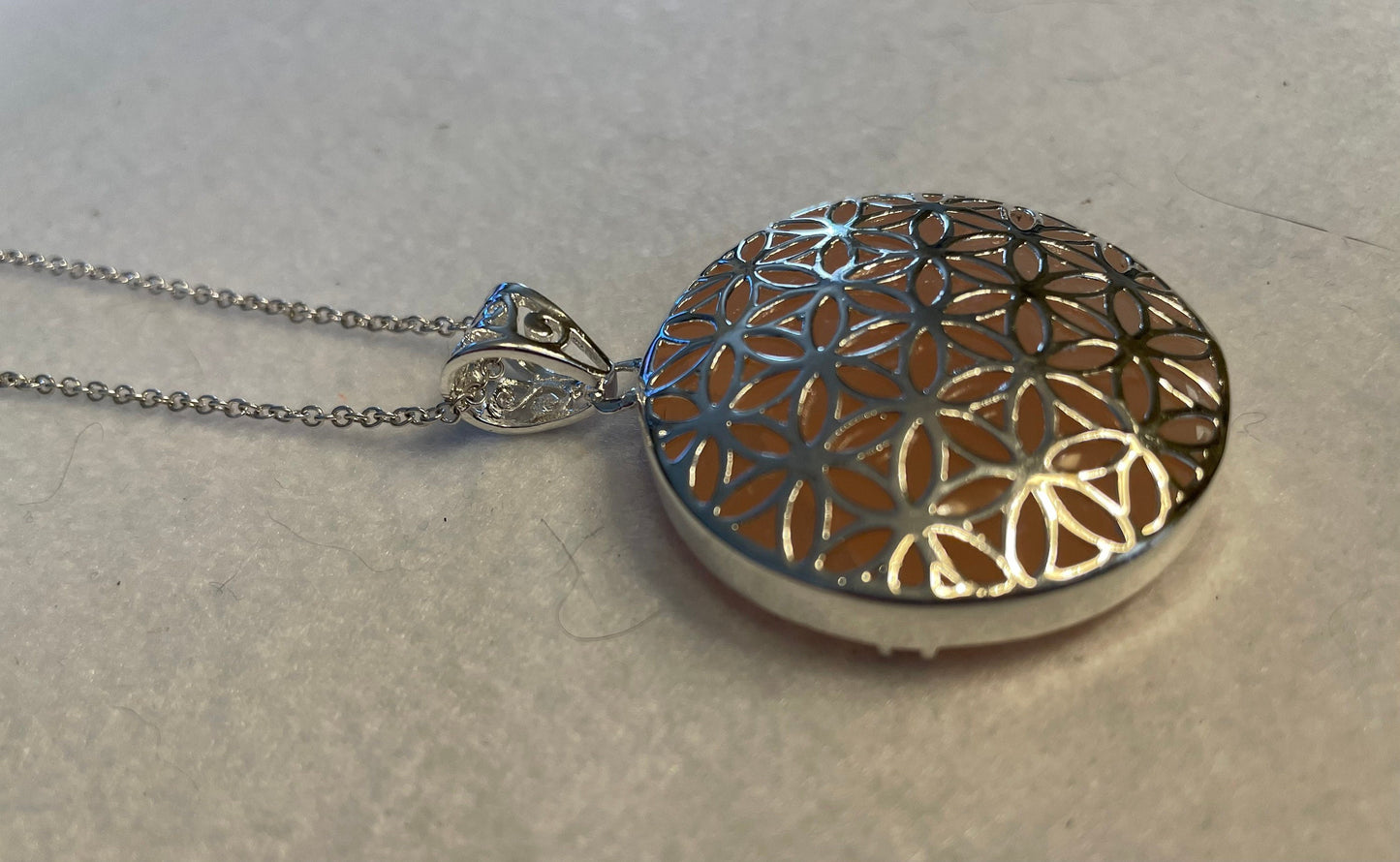 Silver round Flower of Life Rose Quartz crystal necklace on 16+ inch silver plated chain
