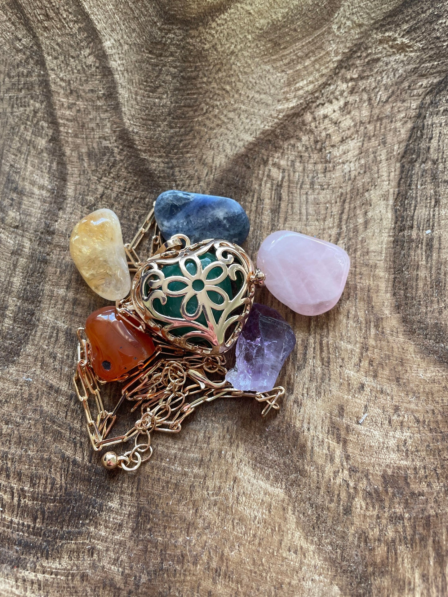 Gold locket with 7 interchangeable crystals on 16+”gold chain