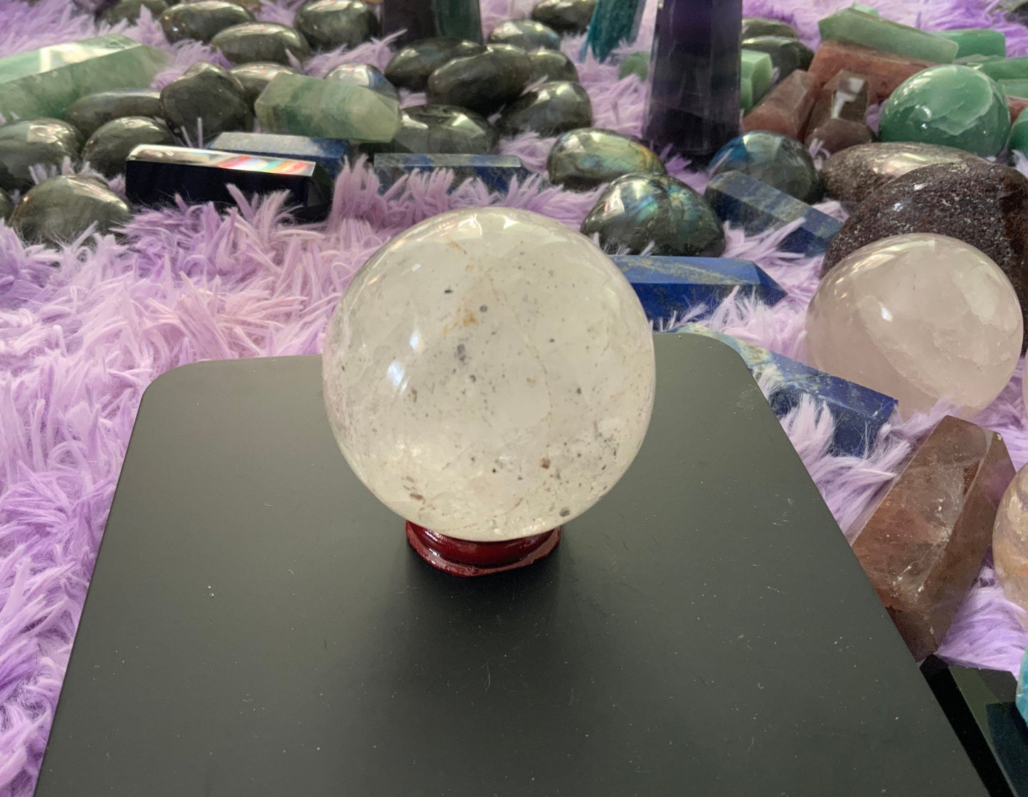 Beautiful 12.5 ounce clear quartz sphere crystal ball with wooden stand