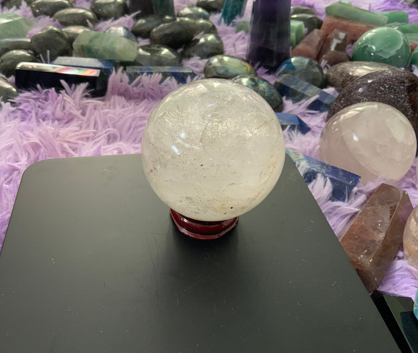 Beautiful 12.5 ounce clear quartz sphere crystal ball with wooden stand