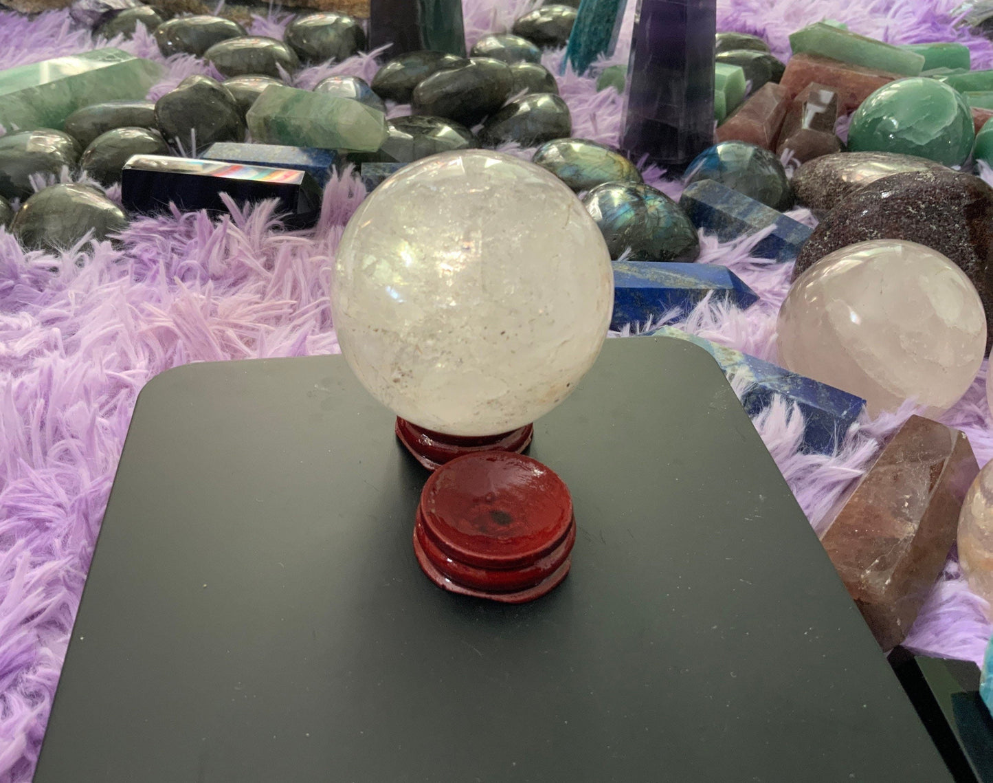 Beautiful 12.5 ounce clear quartz sphere crystal ball with wooden stand