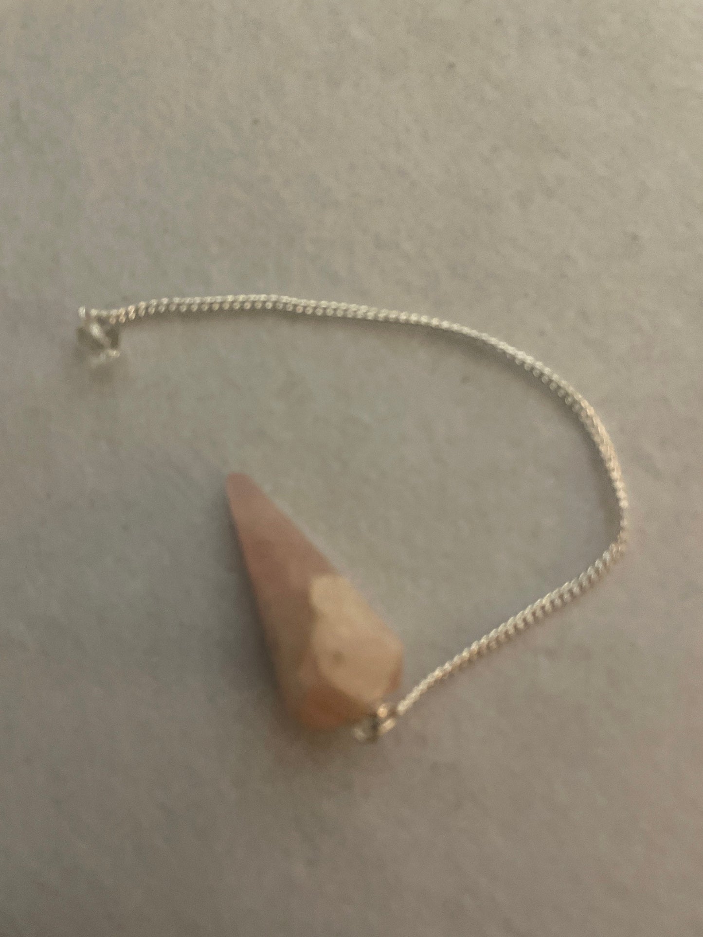This beautiful Rose Quartz Pendulum is 1.65” and with chain is 8”