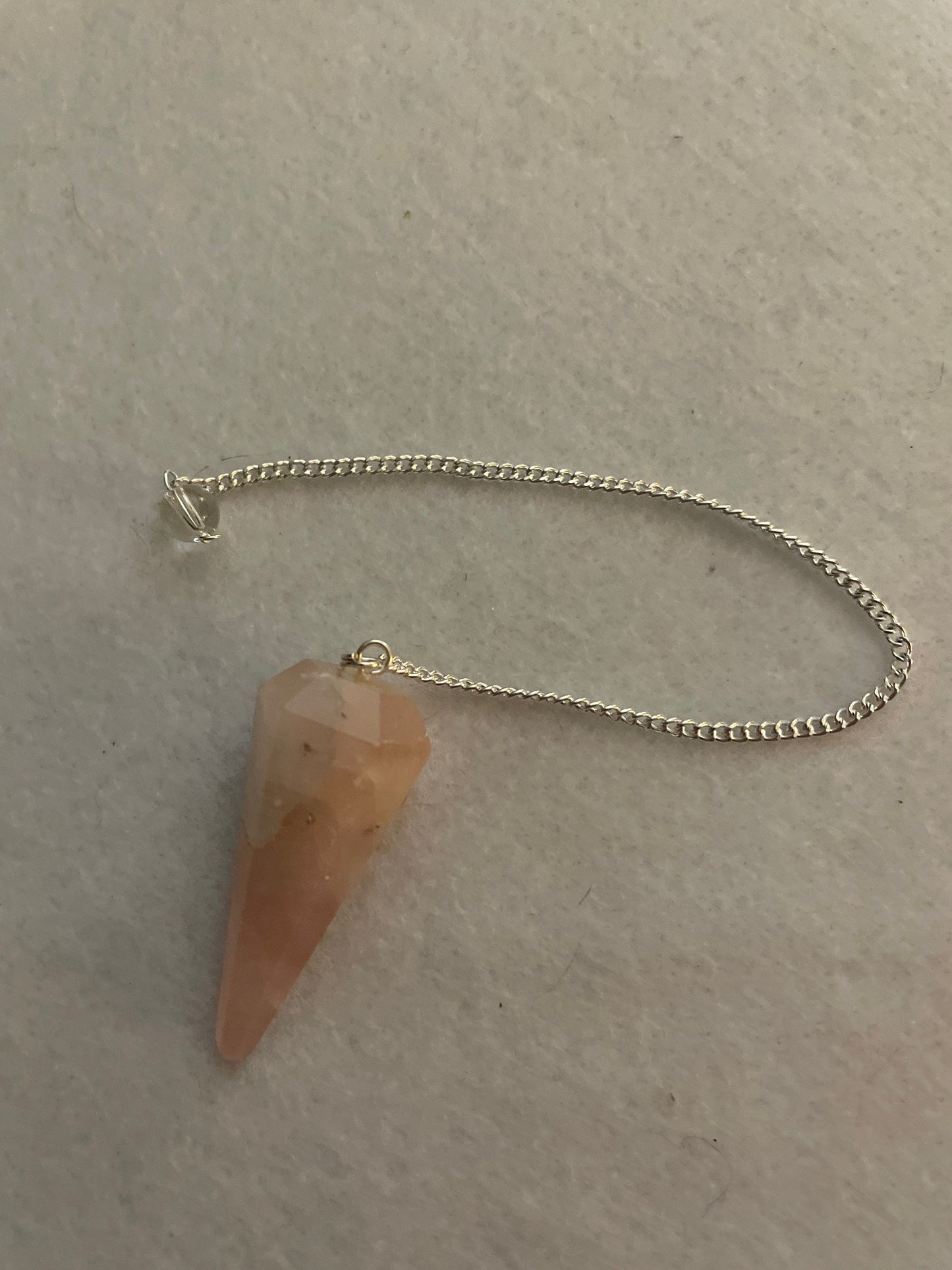 This beautiful Rose Quartz Pendulum is 1.65” and with chain is 8”