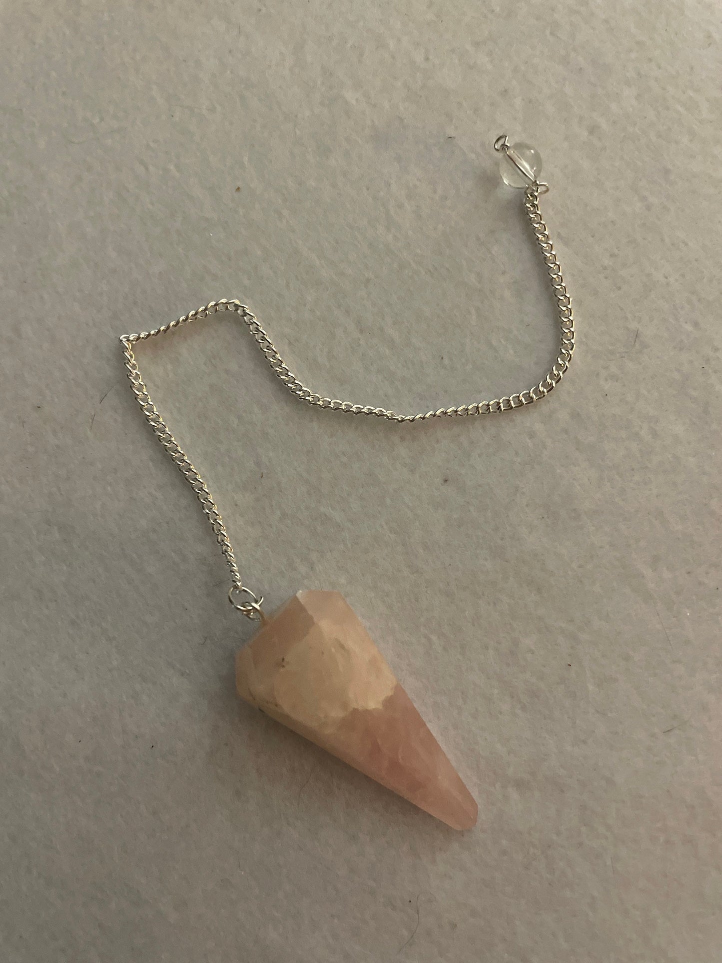 This beautiful Rose Quartz Pendulum is 1.65” and with chain is 8”