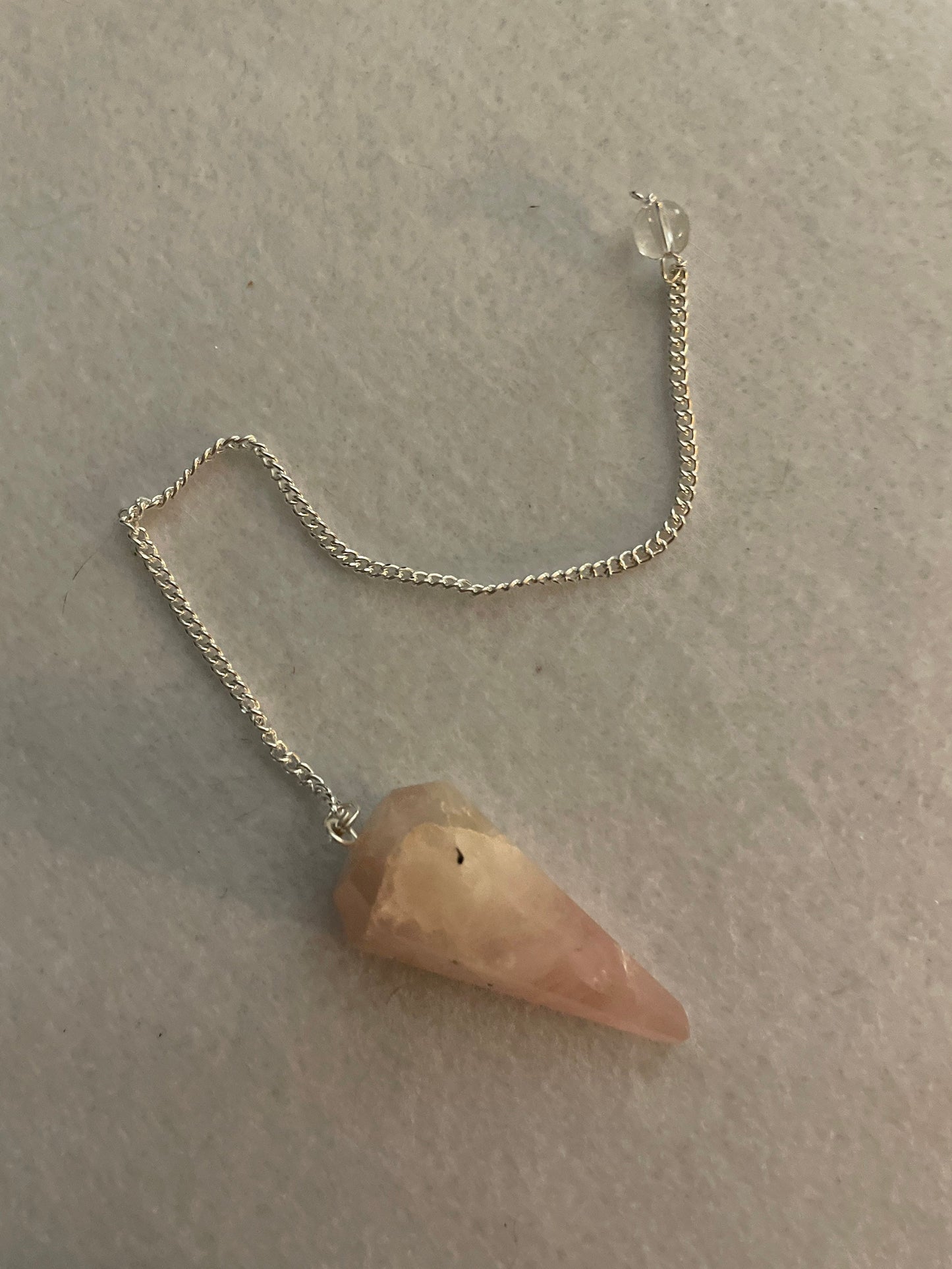 This beautiful Rose Quartz Pendulum is 1.65” and with chain is 8”