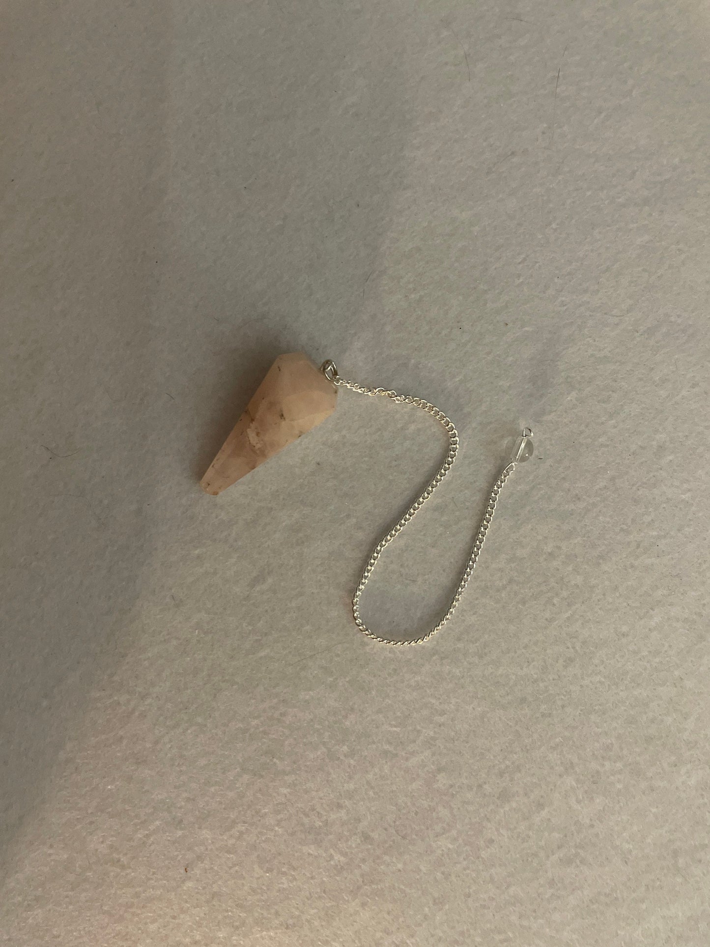 This beautiful Rose Quartz Pendulum is 1.65” and with chain is 8.25”