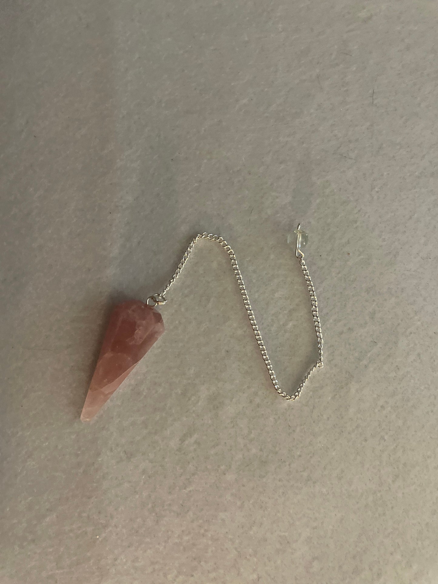 This beautiful Rose Quartz Pendulum is 1.75” and with chain is 8.50”