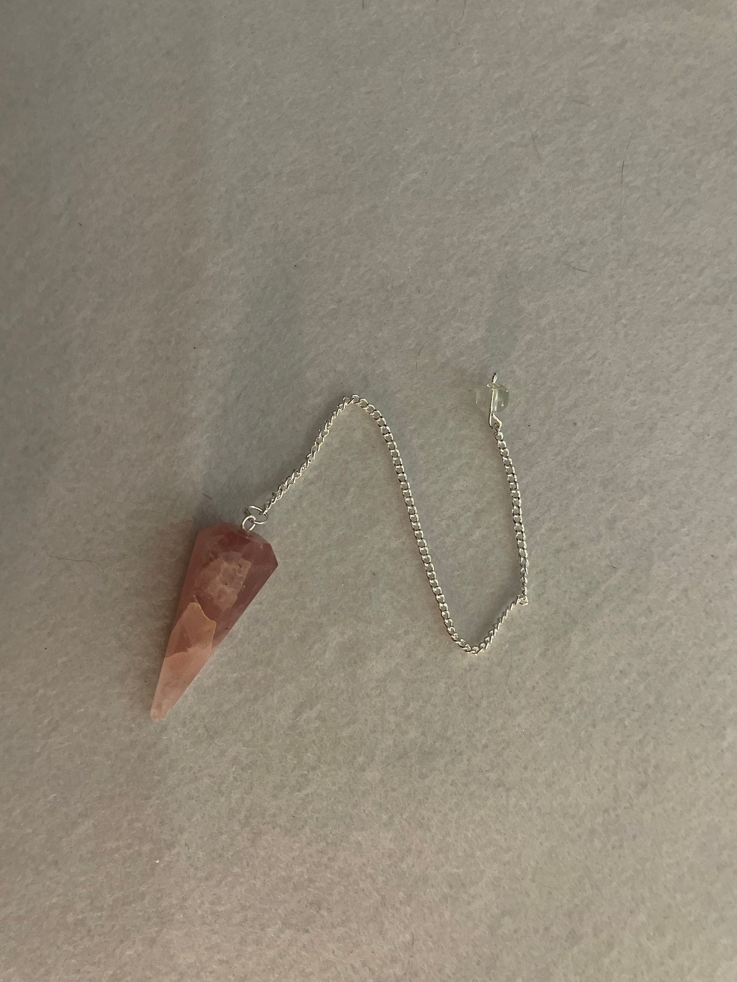 This beautiful Rose Quartz Pendulum is 1.75” and with chain is 8.50”