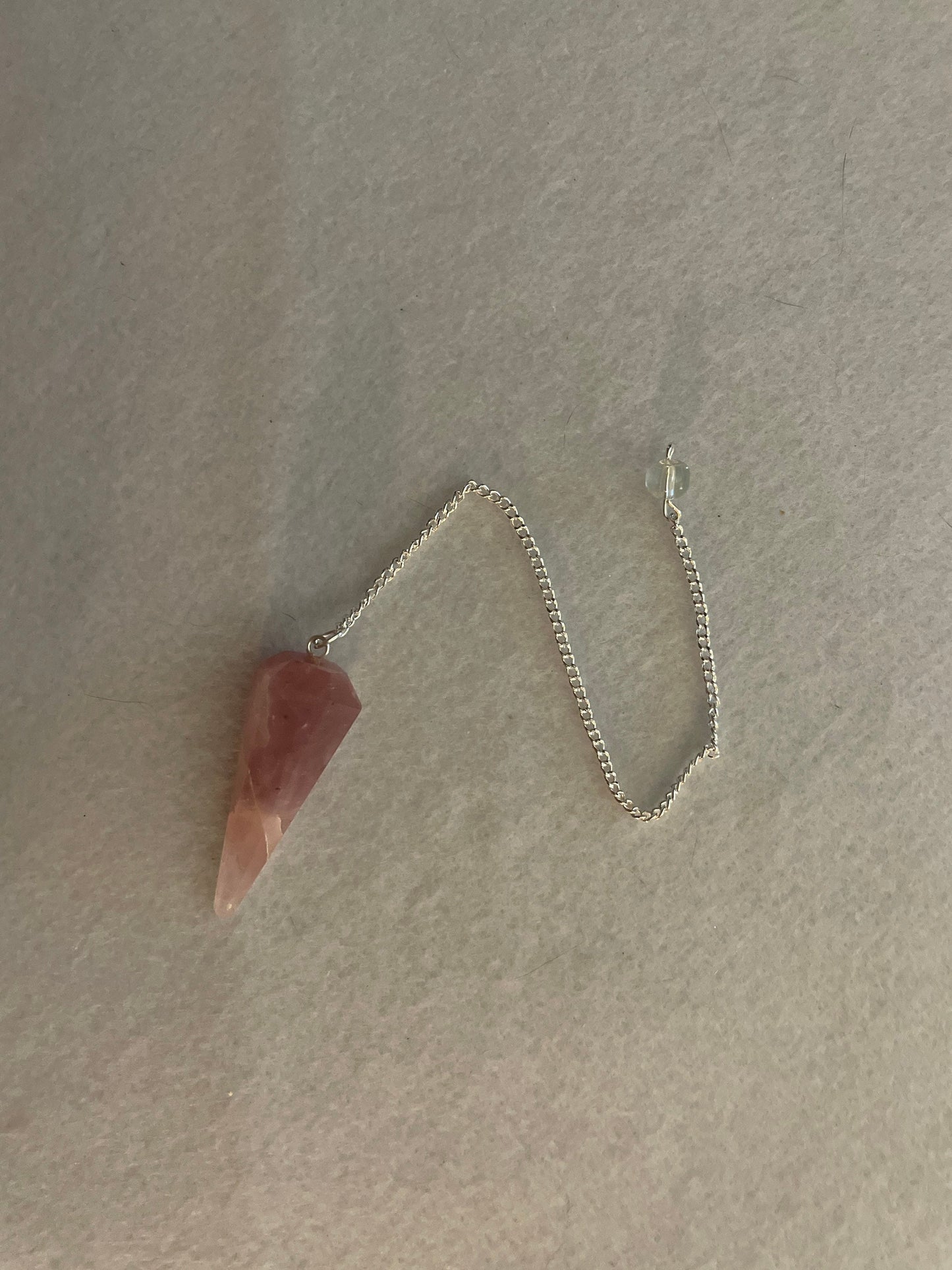 This beautiful Rose Quartz Pendulum is 1.75” and with chain is 8.50”