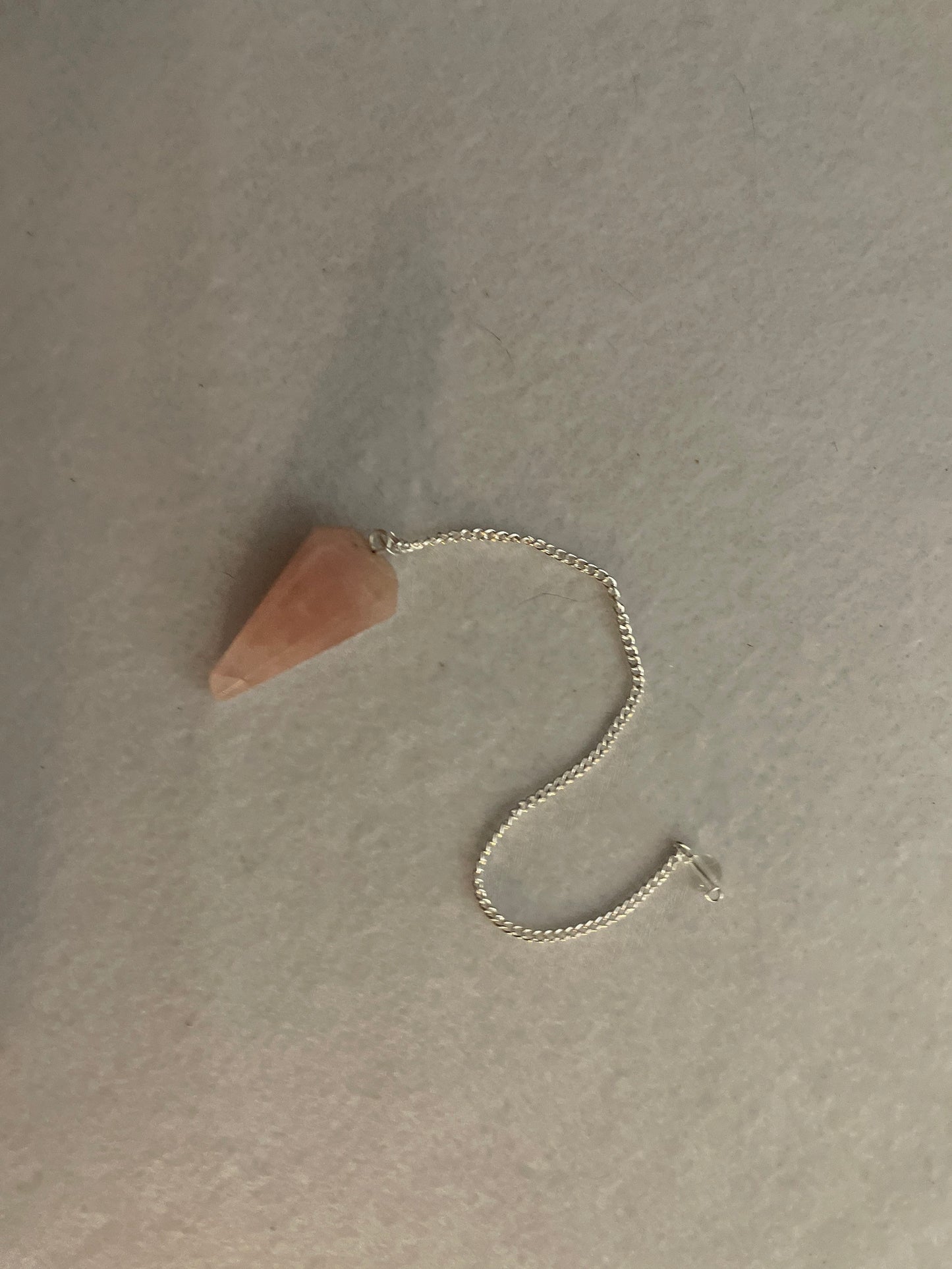 This beautiful Rose Quartz Pendulum is 1.5” and with chain is 8”
