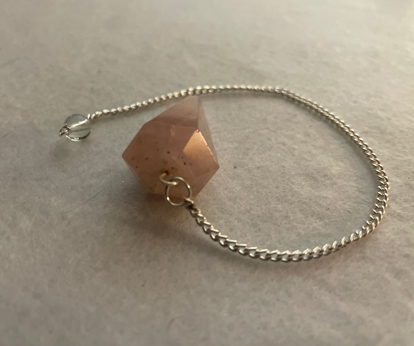 This beautiful Rose Quartz Pendulum is 1.5” and with chain is 8”