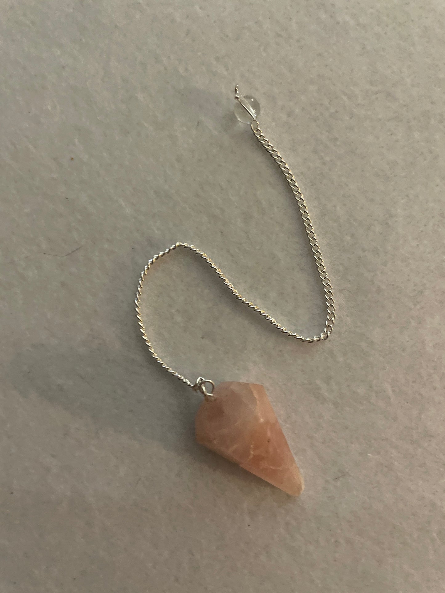 This beautiful Rose Quartz Pendulum is 1.35” and with chain is 8”