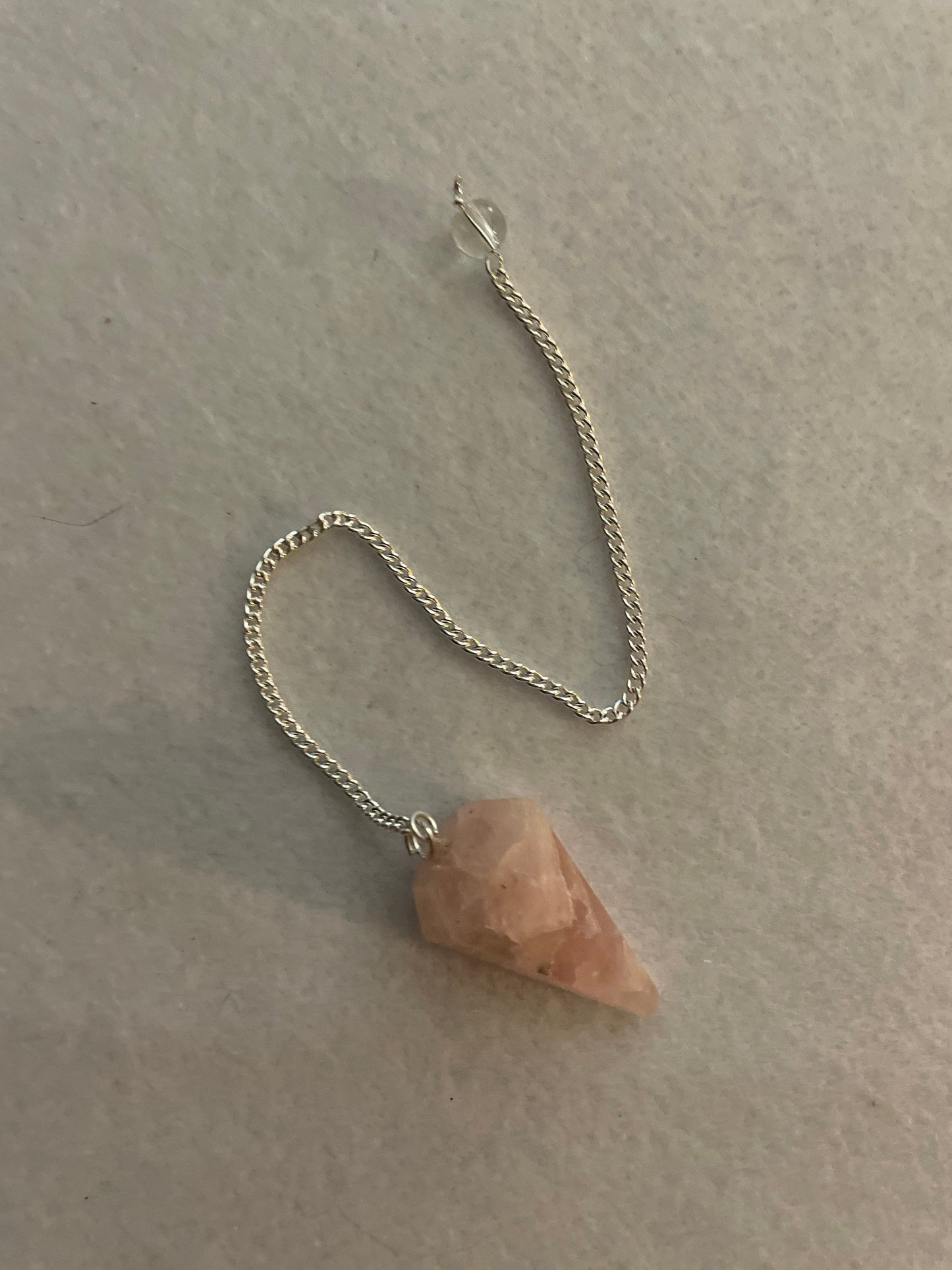 This beautiful Rose Quartz Pendulum is 1.35” and with chain is 8”