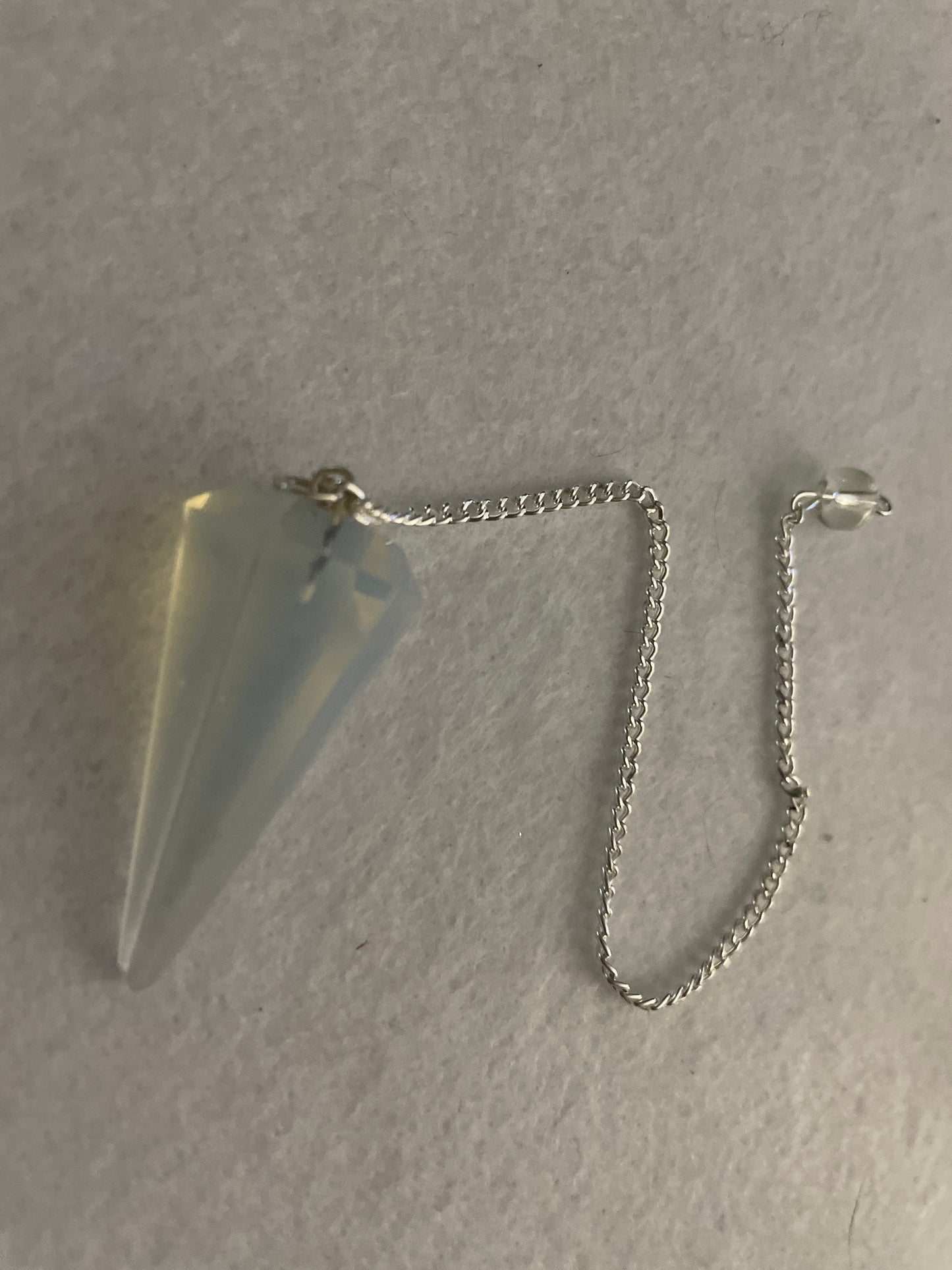 This beautiful  Opalite pendulum is approximately 1.5” and with chain is 8.25”