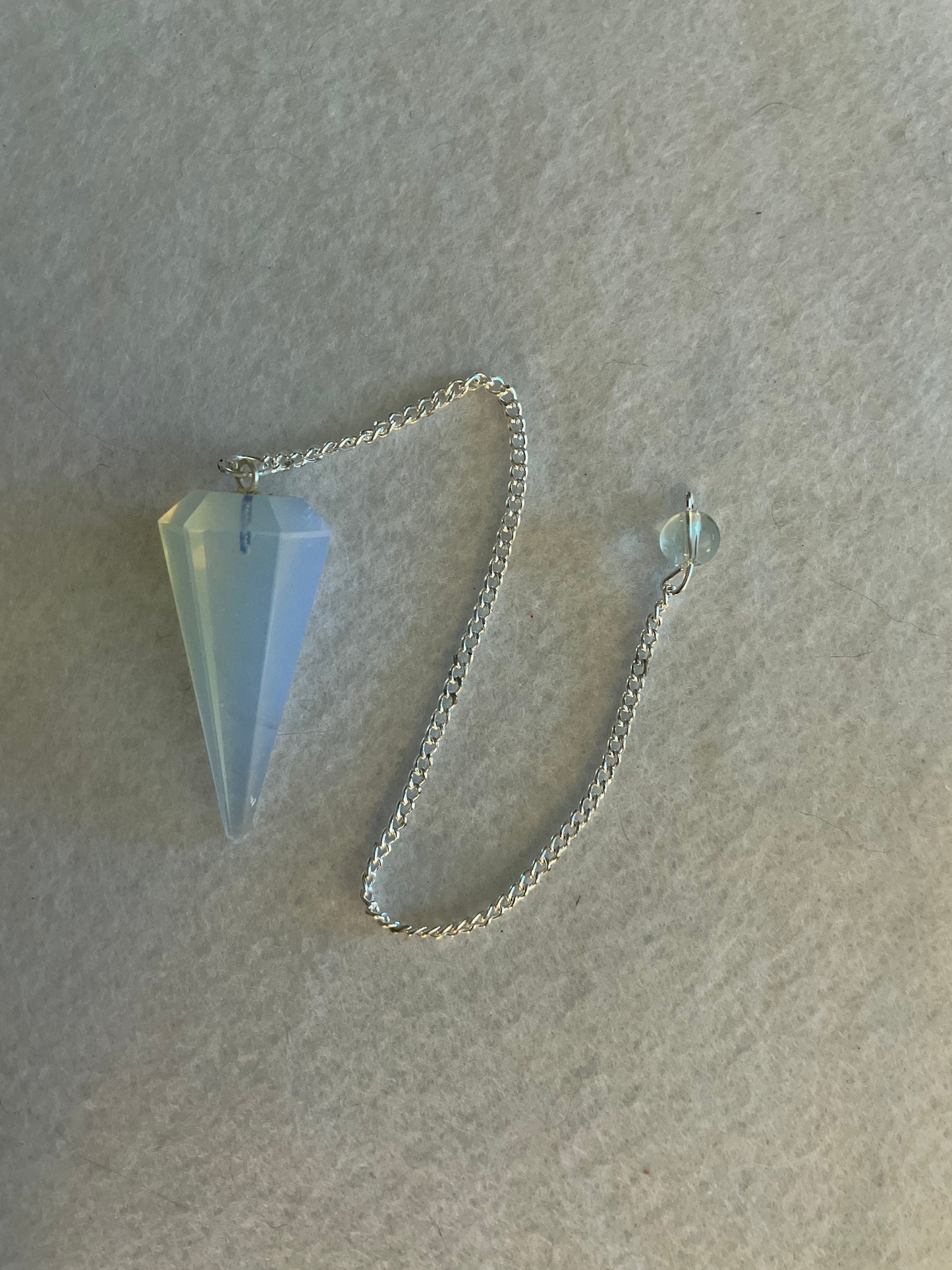 This beautiful  Opalite pendulum is approximately 1.65” And with chain is 8.5”