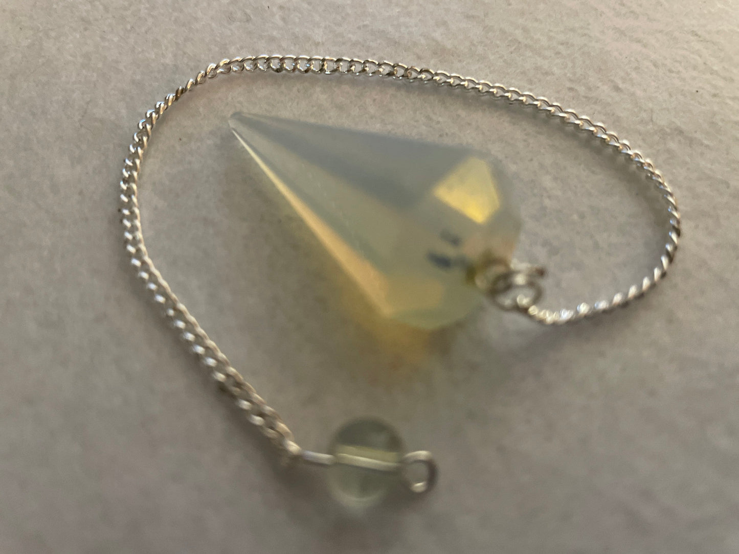 This beautiful  Opalite pendulum is approximately 1.65” And with chain is 8.5”