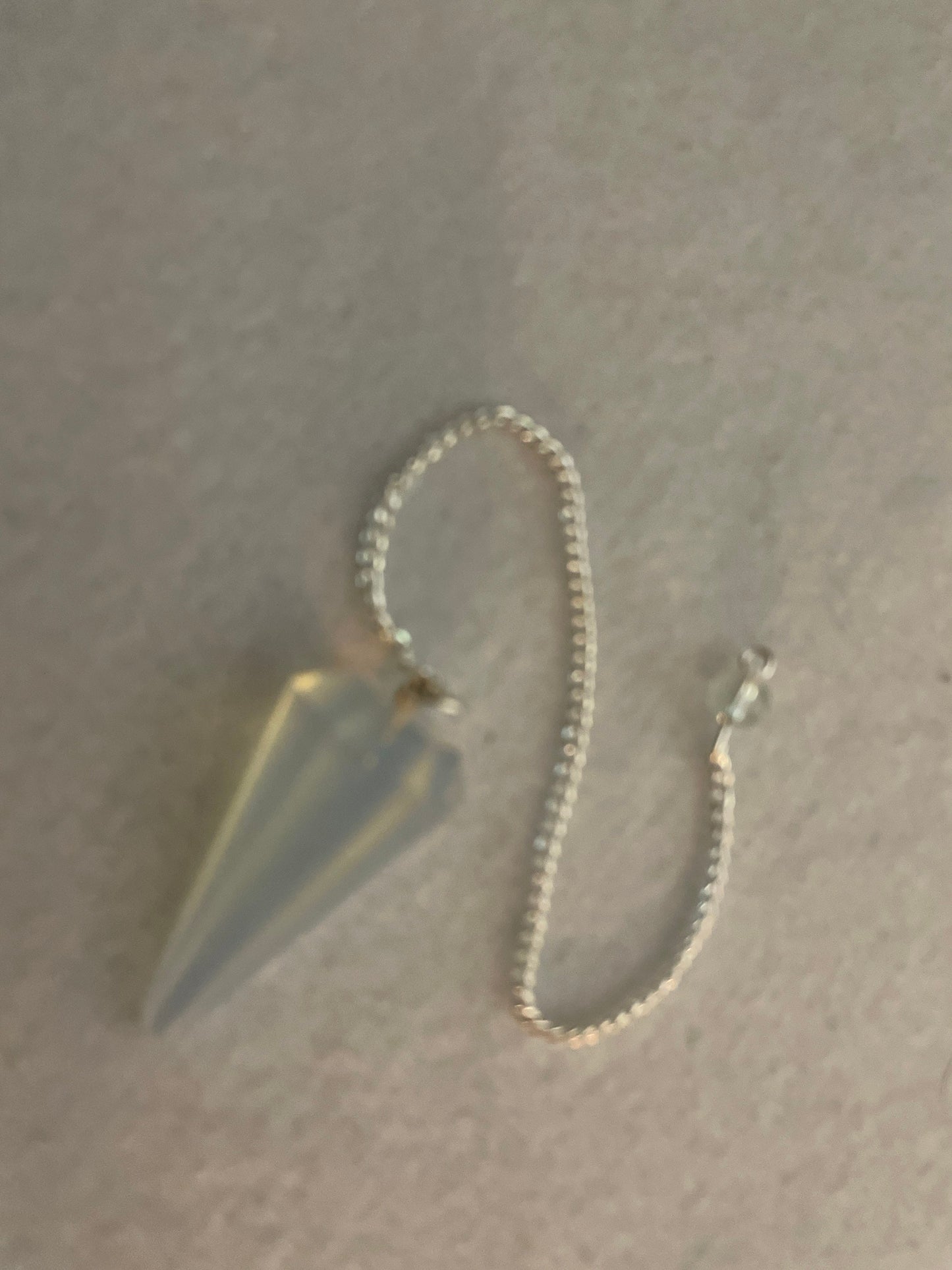 This beautiful  Opalite pendulum is approximately 1.65” and with chain is 8.5”