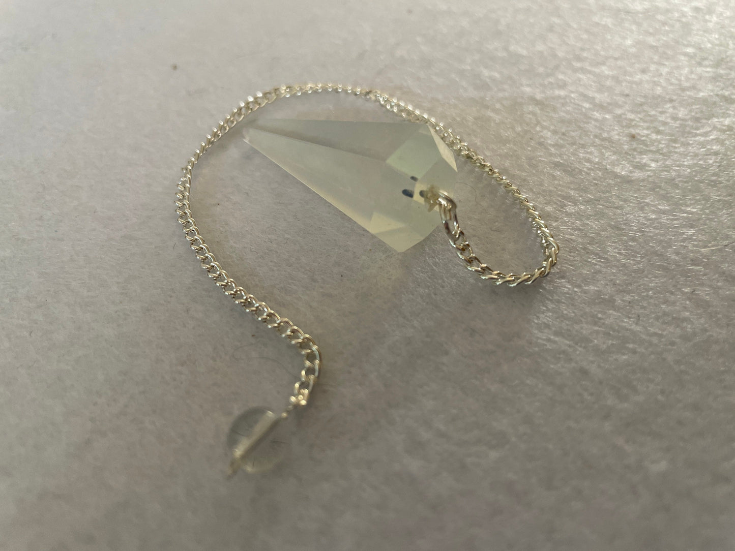Opalite pendulum is approximately 1.65” and with chain is 8.5” total length