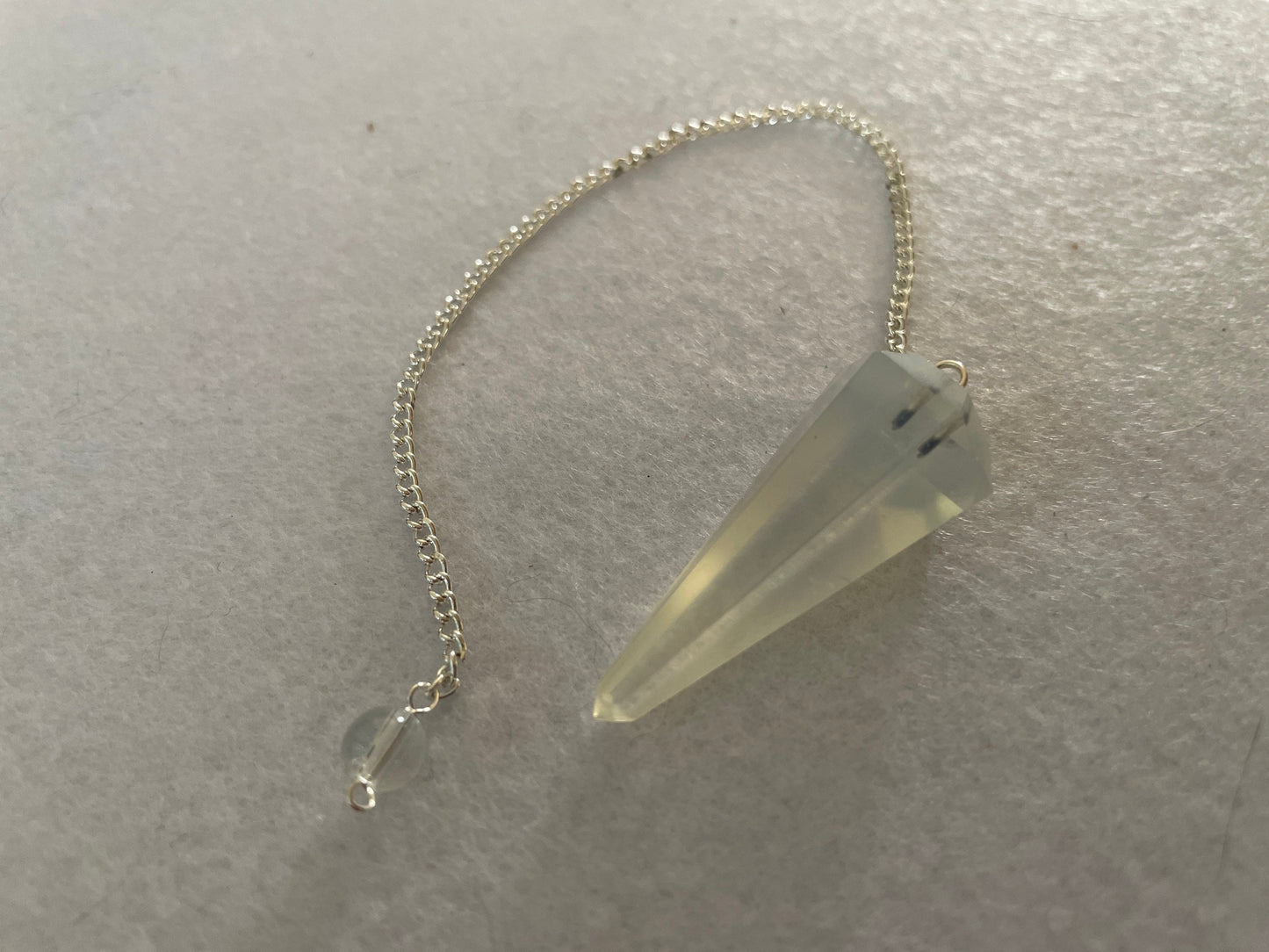 Opalite pendulum is approximately 1.65” and with chain is 8.5” total length
