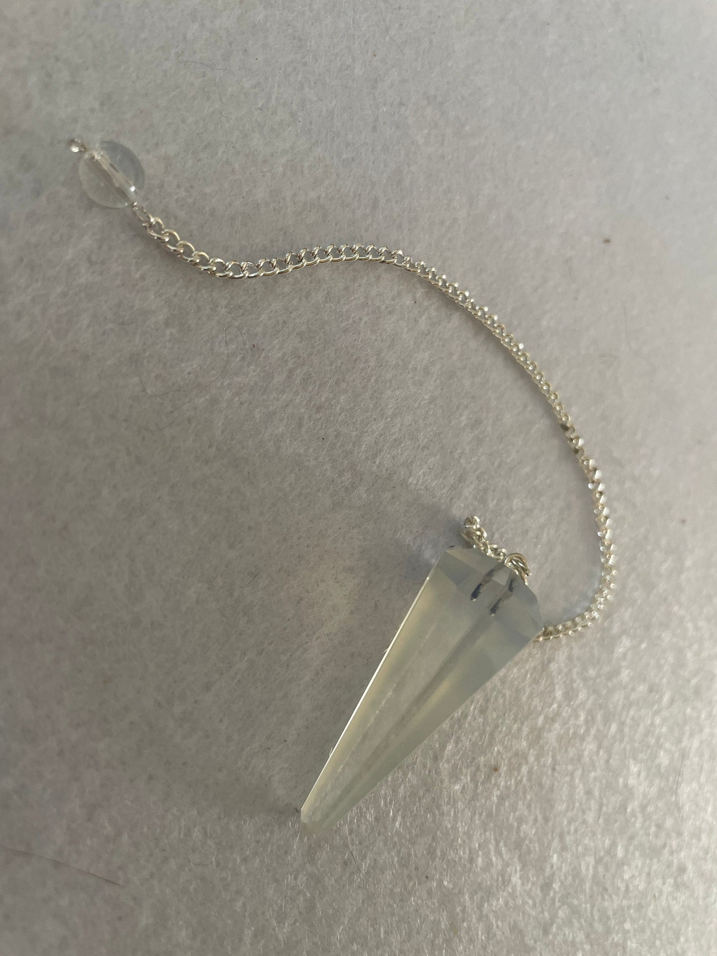 Opalite pendulum is approximately 1.65” and with chain is 8.5” total length