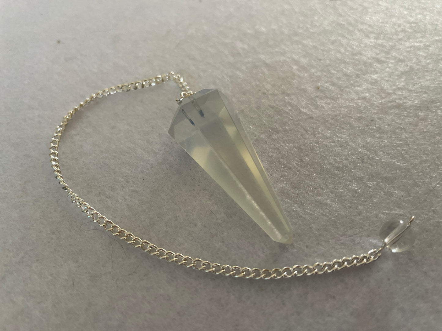 Opalite pendulum is approximately 1.65” and with chain is 8.5” total length