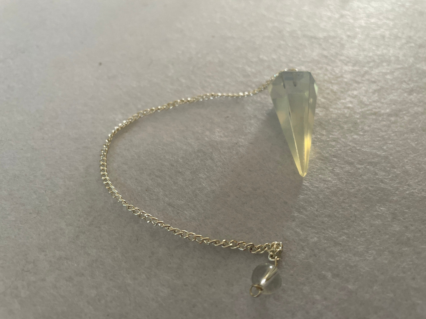 Pretty Opalite pendulum is approximately 1.5” and with chain is 8” total length